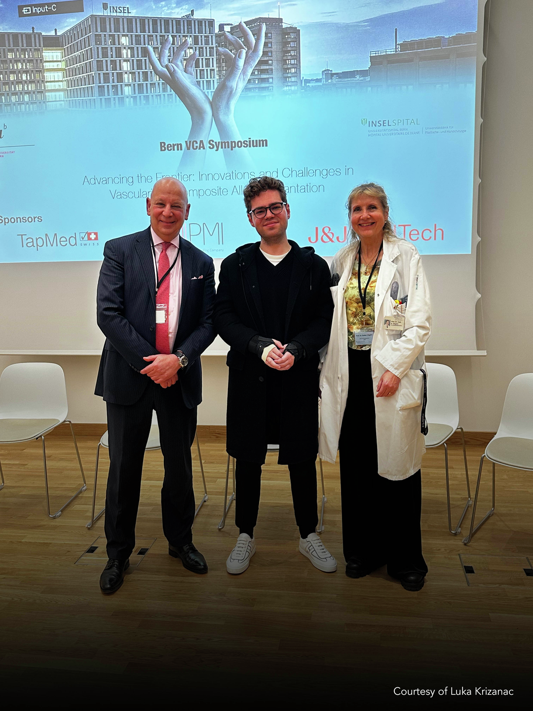 Luka Krizanac with Swiss surgeon Esther Vögelin and Penn Medicine’s Scott Levin in front of a VCA Symposium presentation