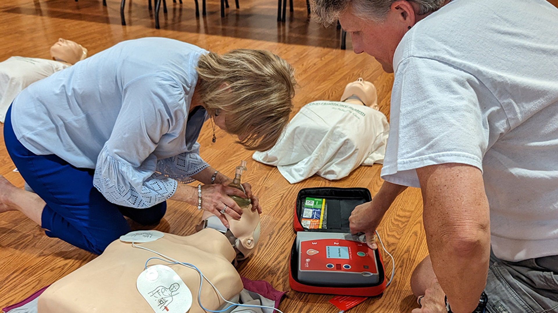 Woman receiving free CPR instruction