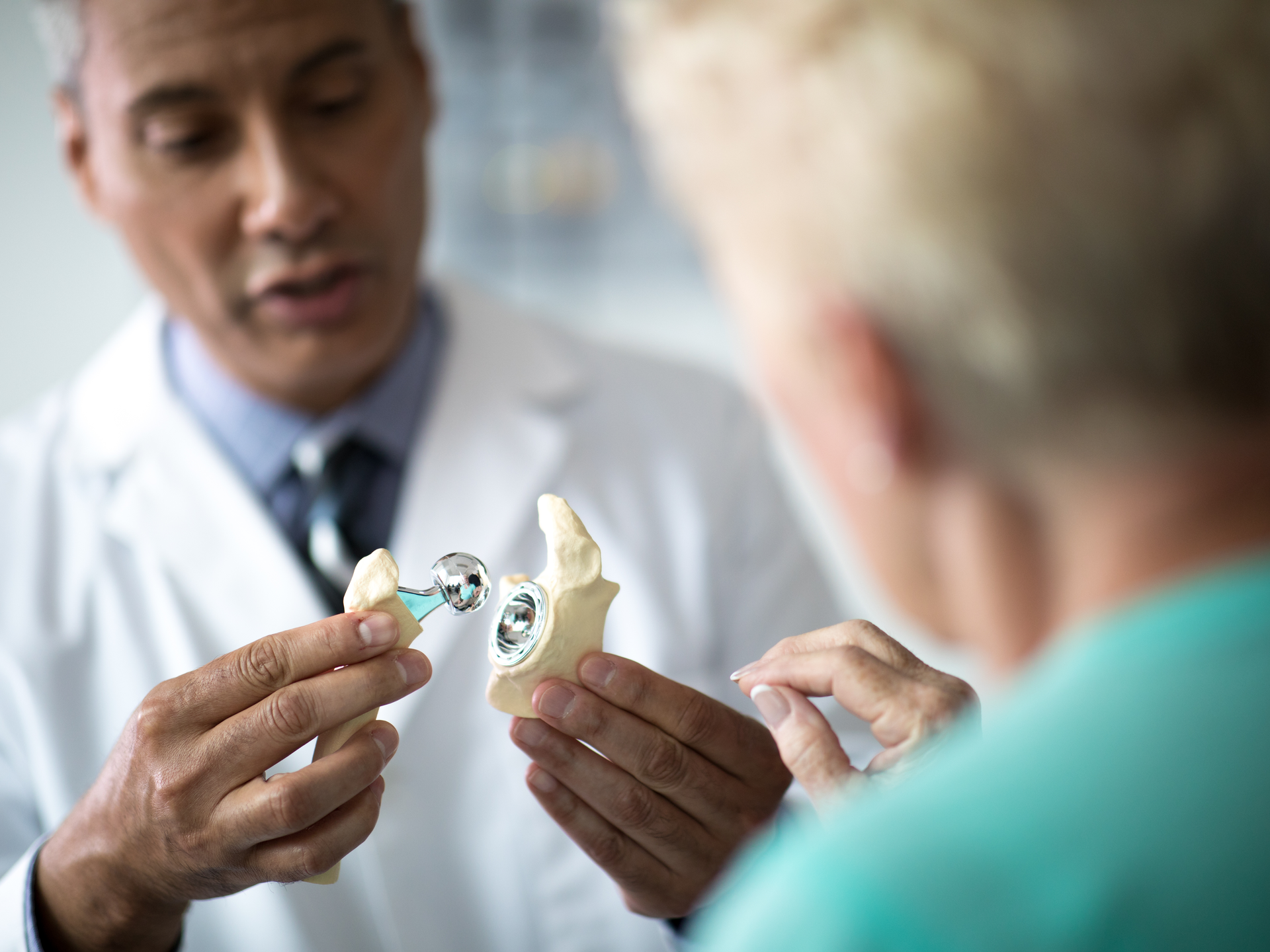 Penn Medicine orthopaedic doctor demonstrates hip replacement for patient