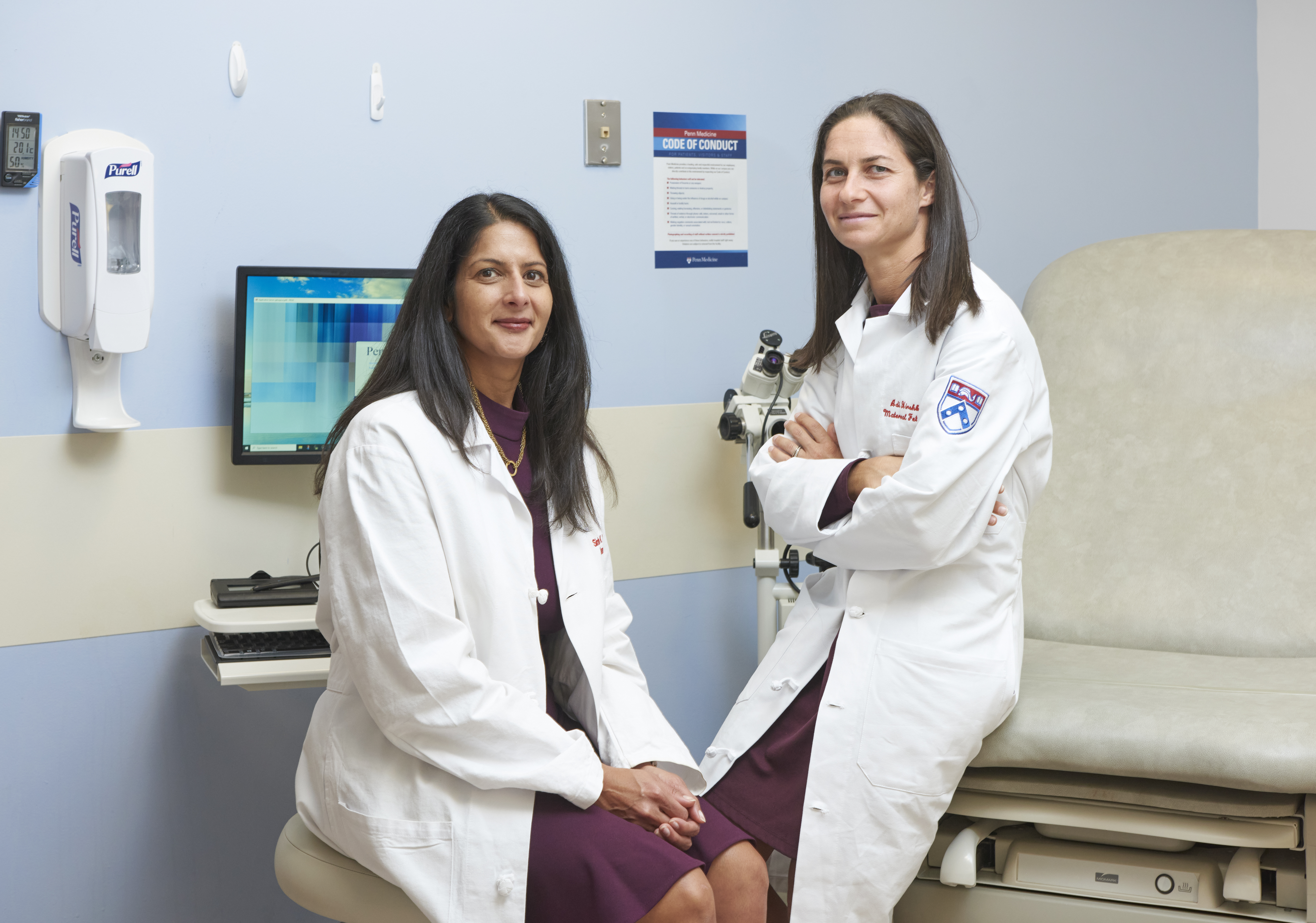 Sindhu Srinivas, MD, and Adi Hirshberg, MD, stand together in an exam room