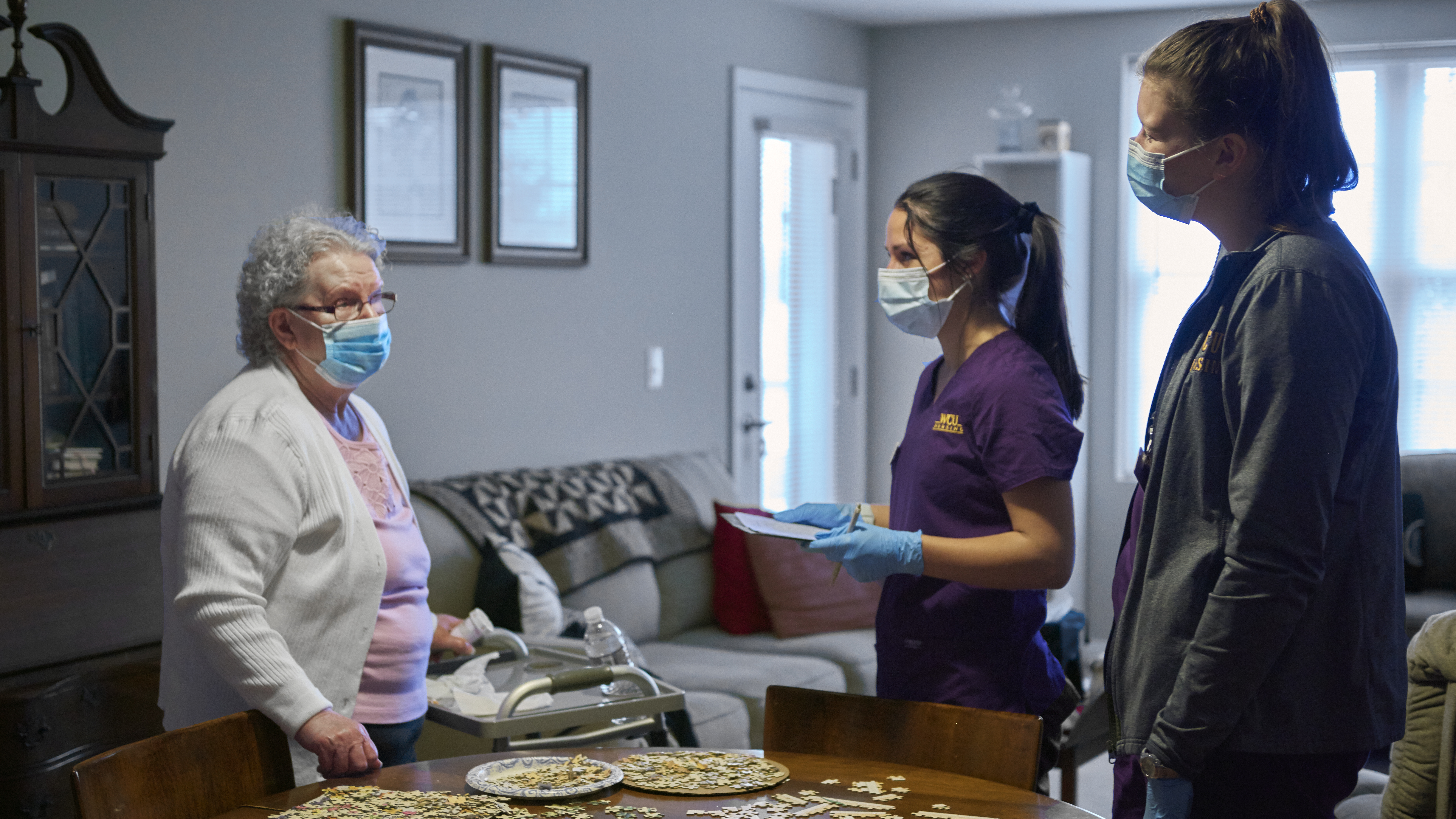 Peggy Reed speaks with West Chester University student nurses Jenna Ricciani and Abigail Shea