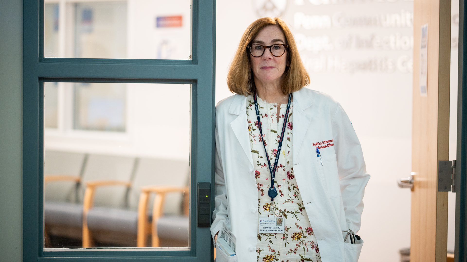 Judith O’Donnell standing in a doorway at a Penn Medicine facility.