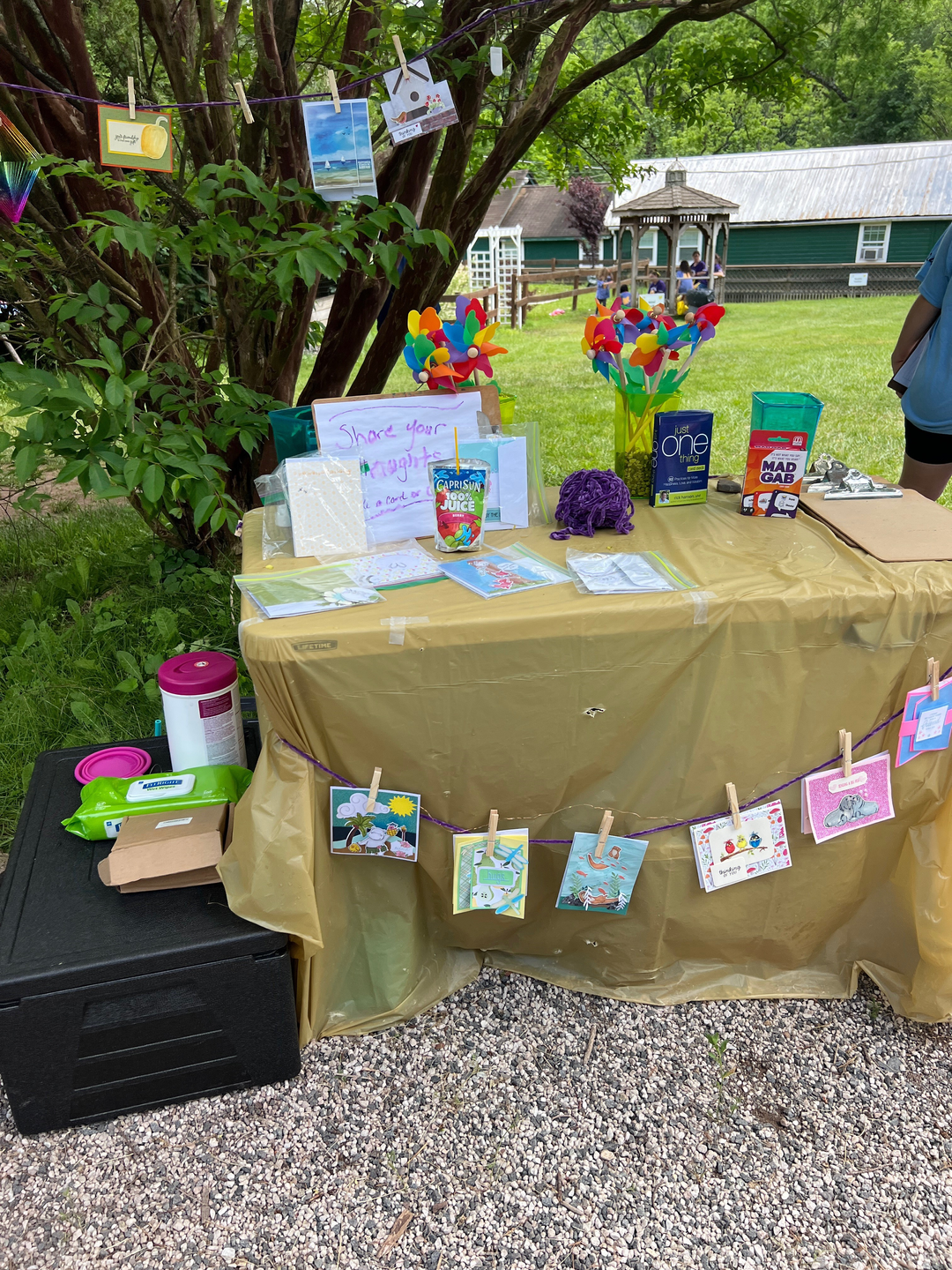 Cards and notes made by campers on a table at Camp Erin
