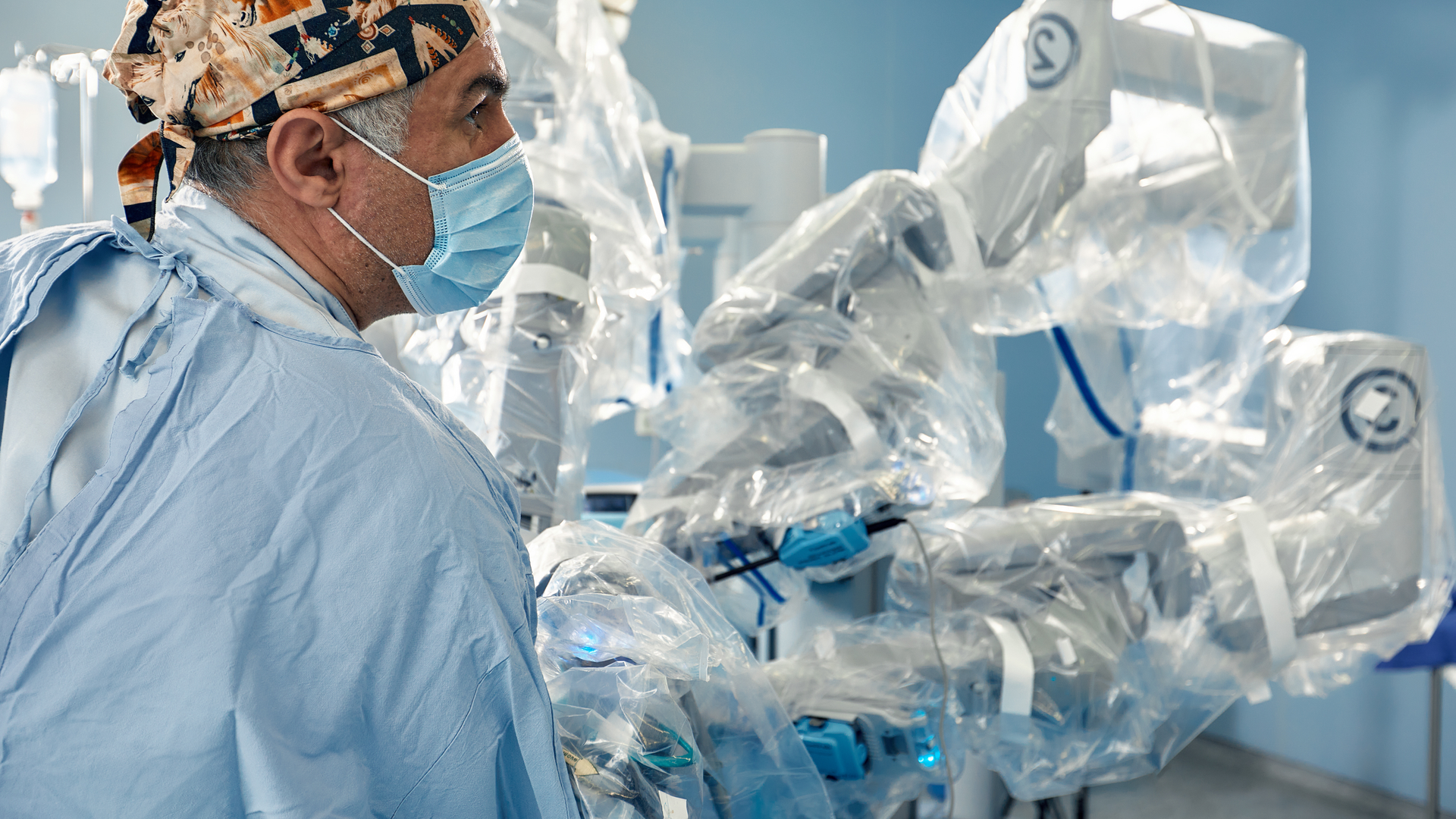 Surgeon in front of minimal invasive robot surgical system in hospital