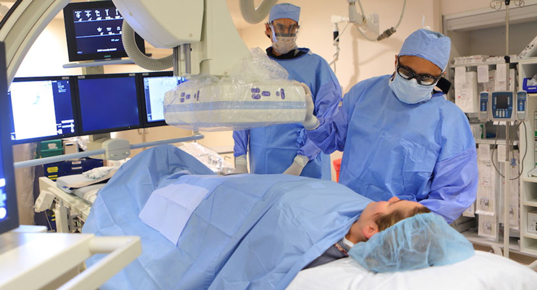 Interventional radiologists with patient