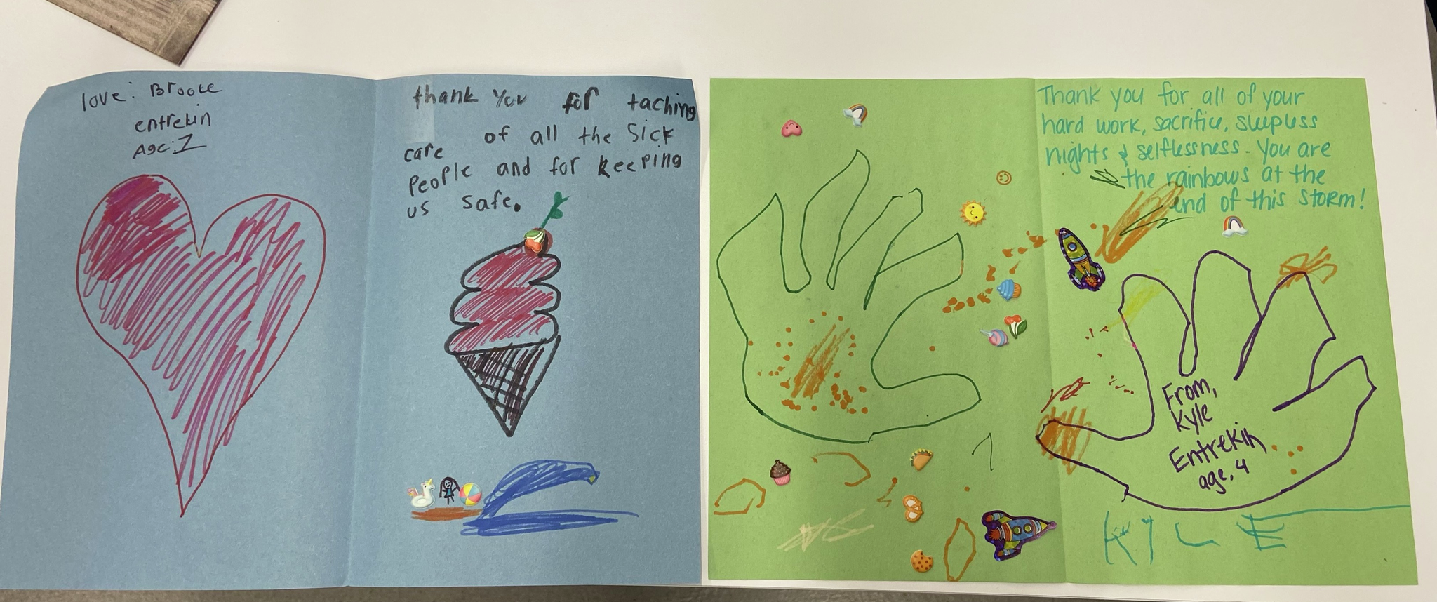 Homemade thank you cards made by children on construction paper with notes of thanks to hospital staff
