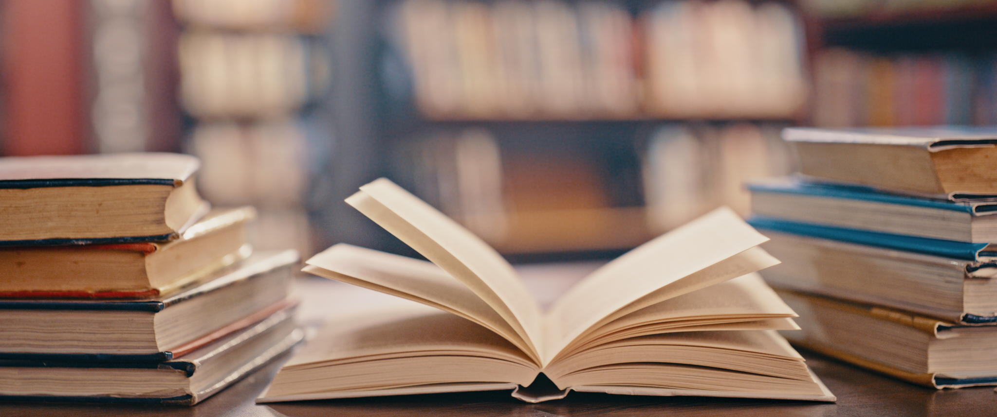 A book open on a library table