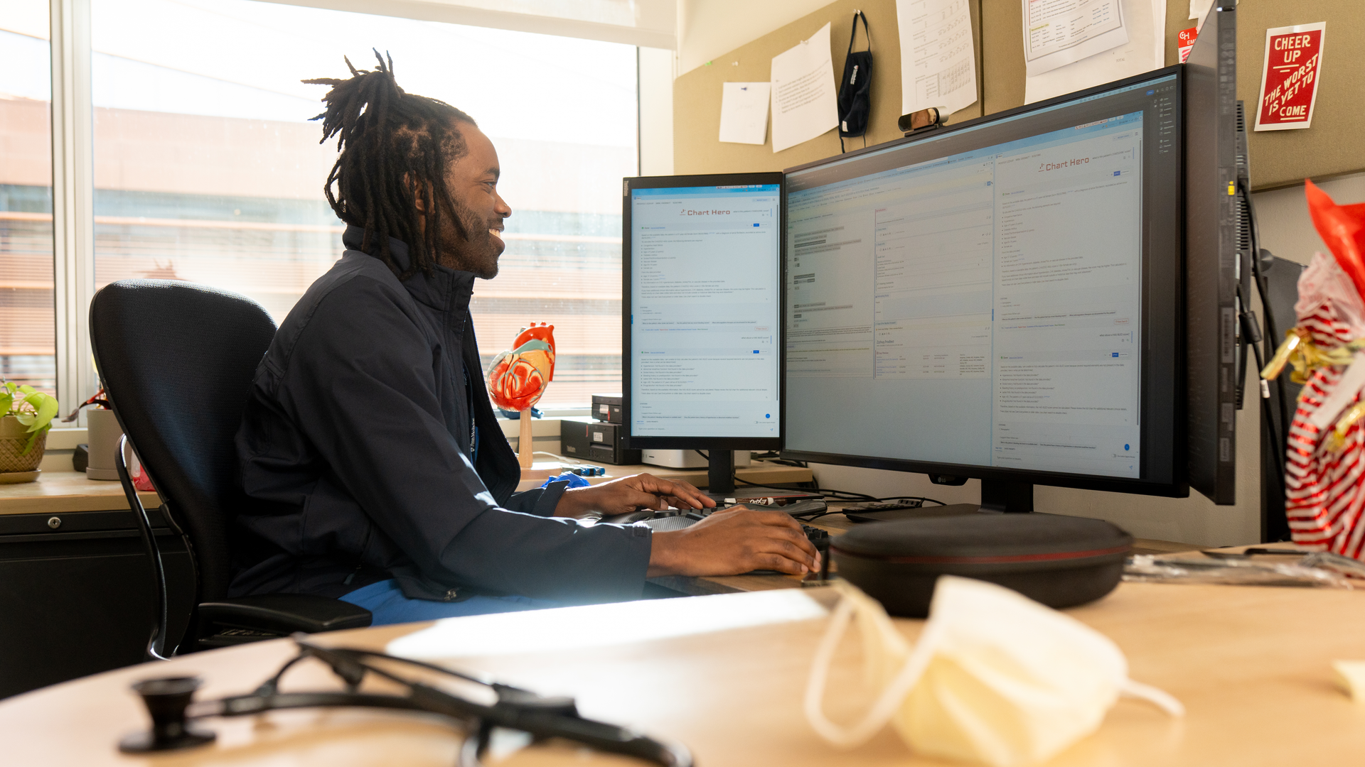 Emeka Anyanwu, a clinician-engineer who uses the Chart Hero platform, is shown using the tool at a computer