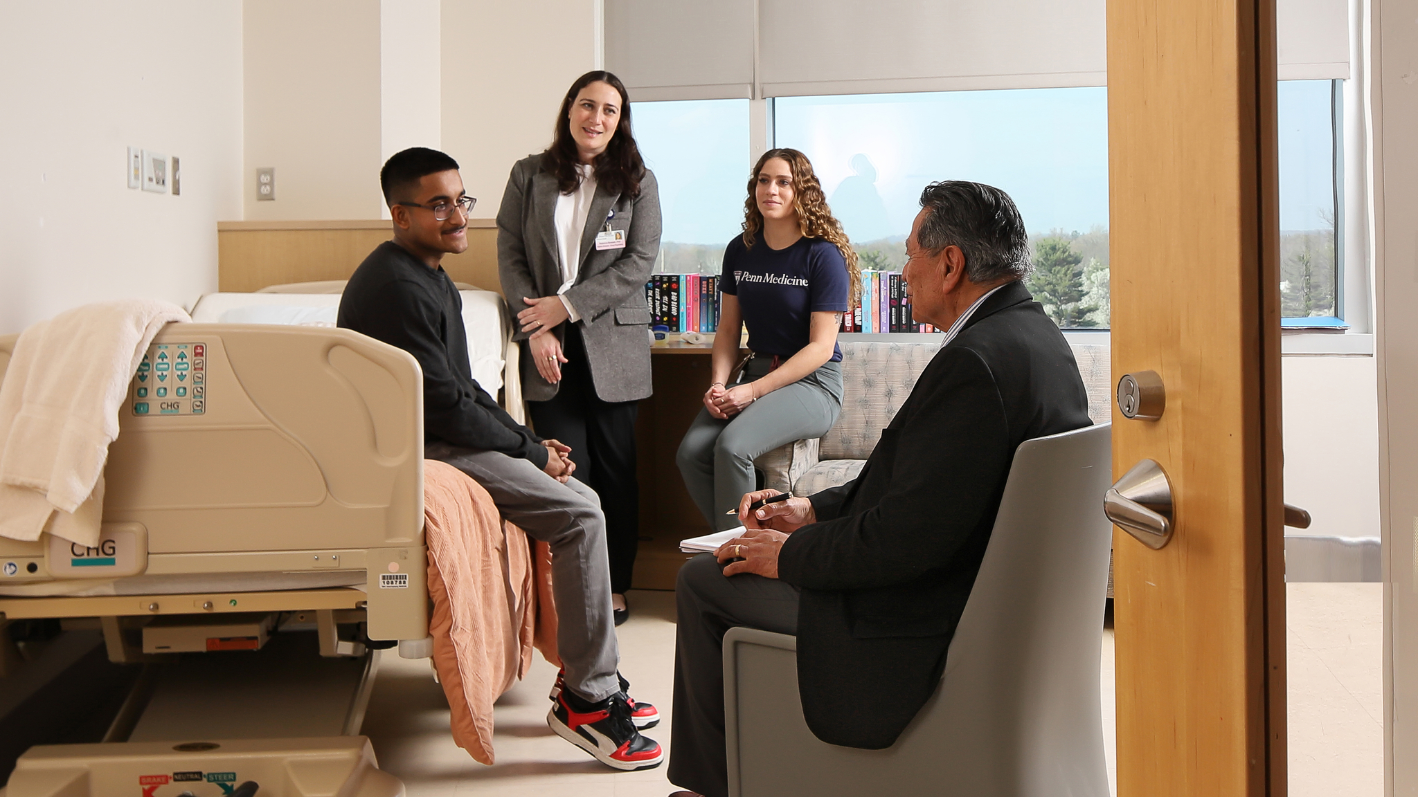 Therapist and patients talking ina patient room