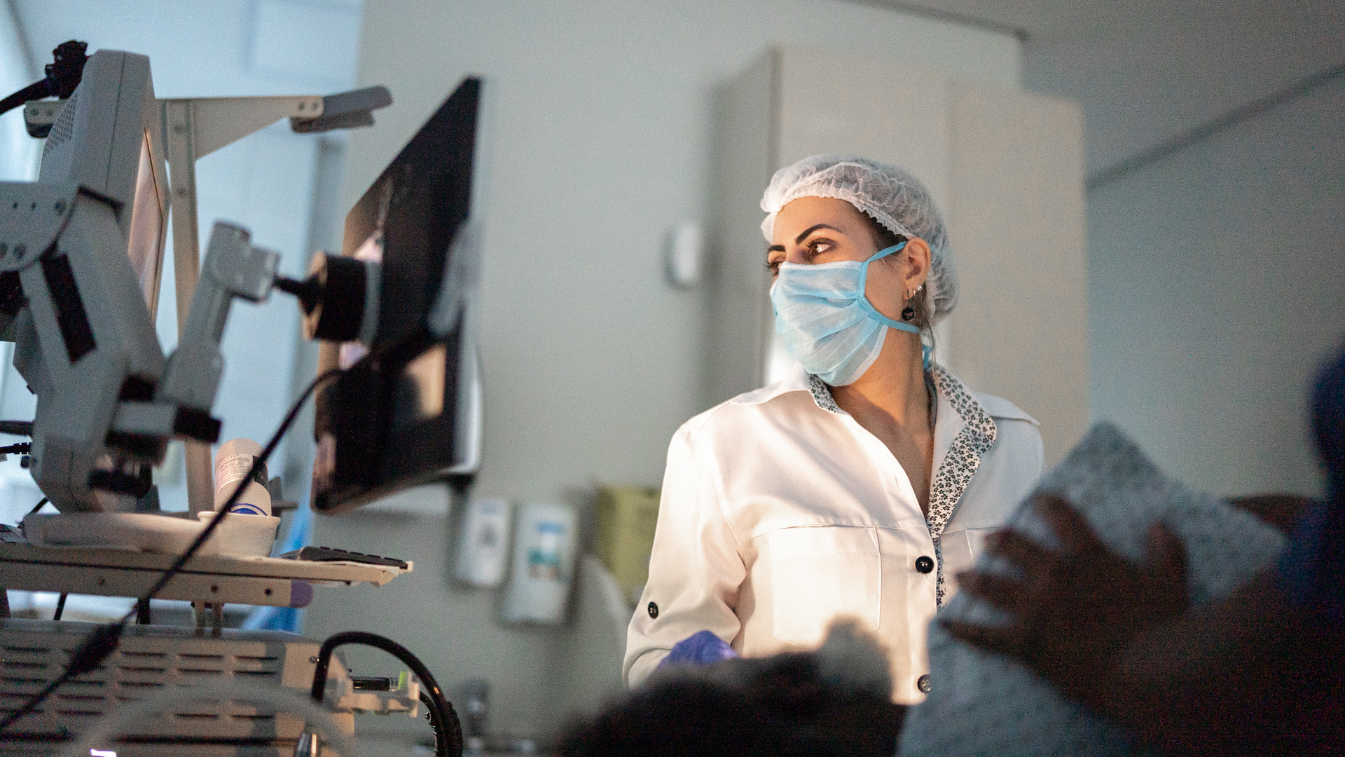 Doctor examining patient with endoscope
