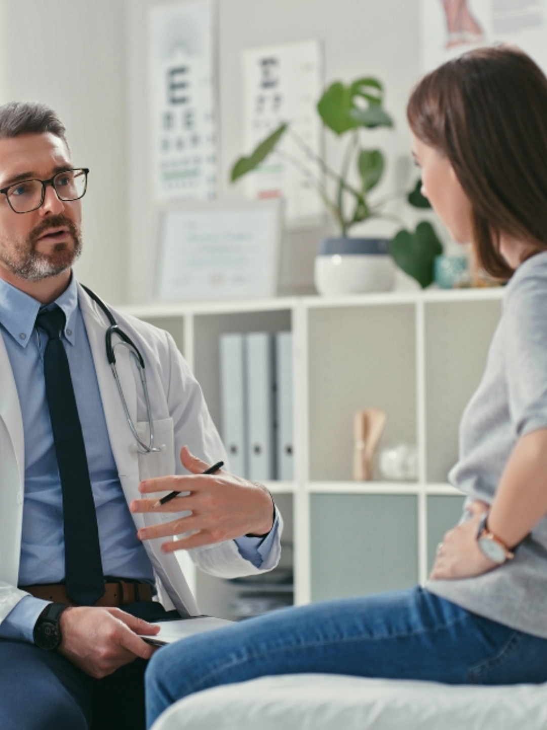 A physician is shown counseling a young patient