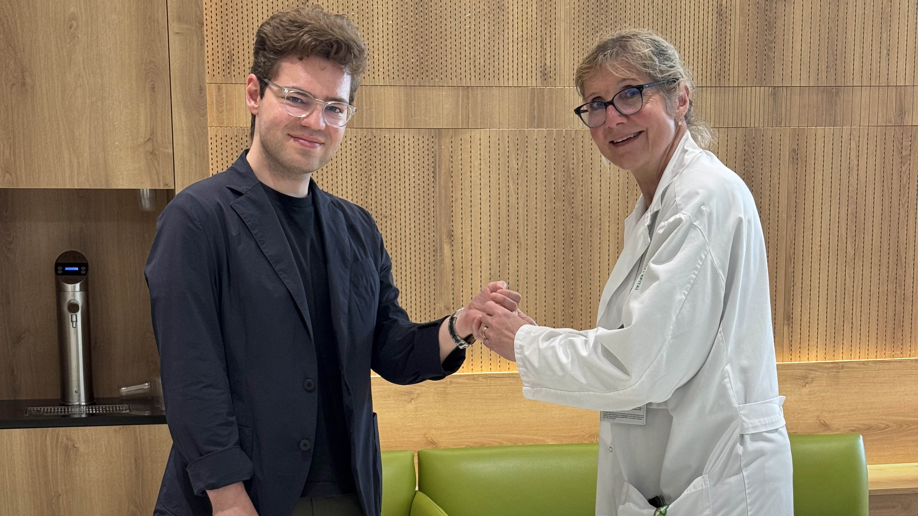 Luka Krizanac’s Swiss surgeon, Esther Vögelin, holding one of Luka's hands in hers