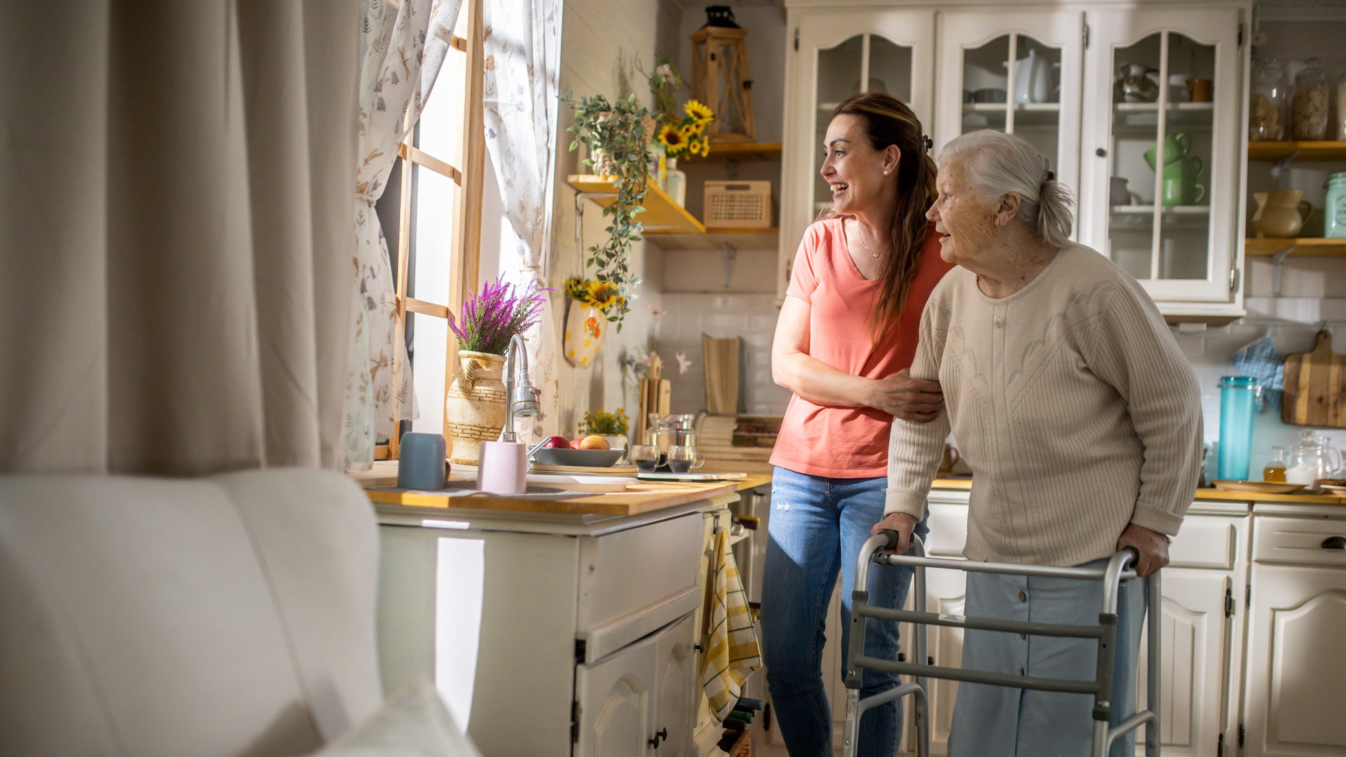 daughter Assisting Senior Woman with Walker at home