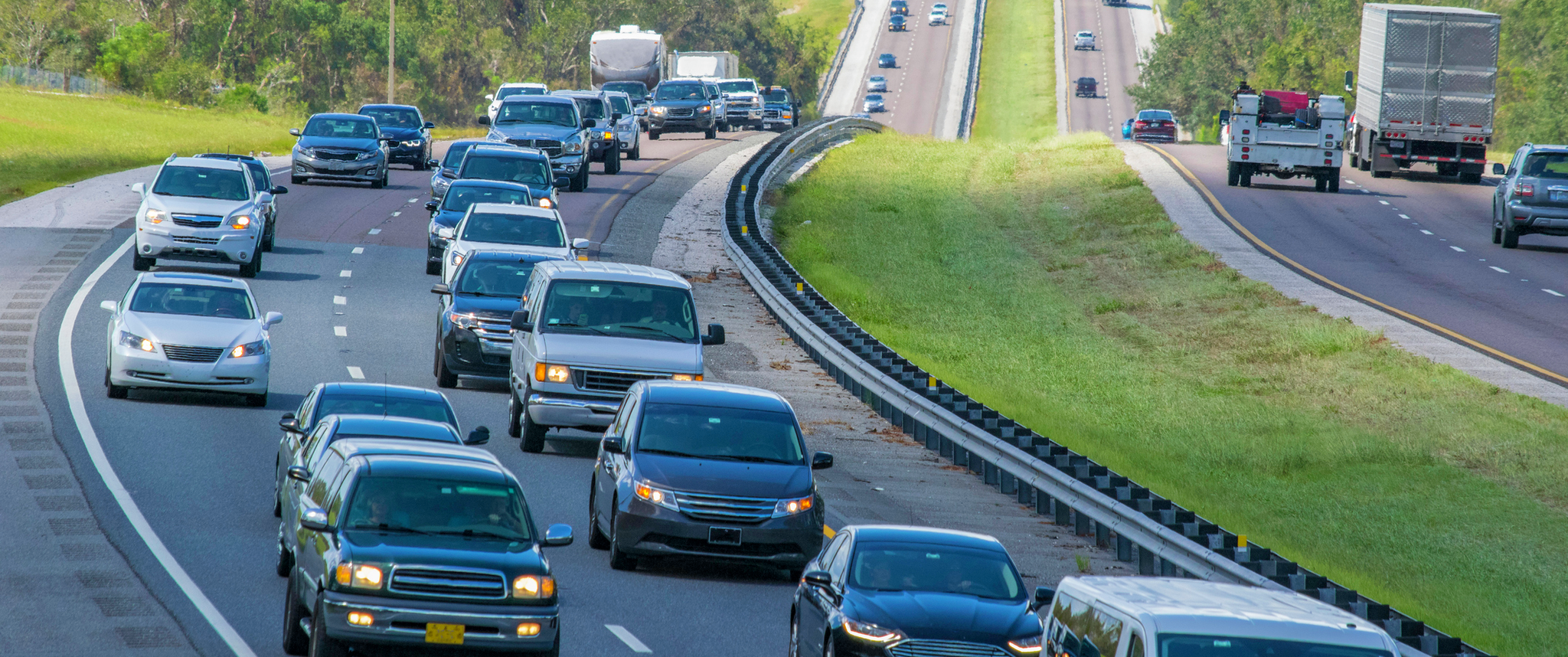 Automobiles driving on a split highway