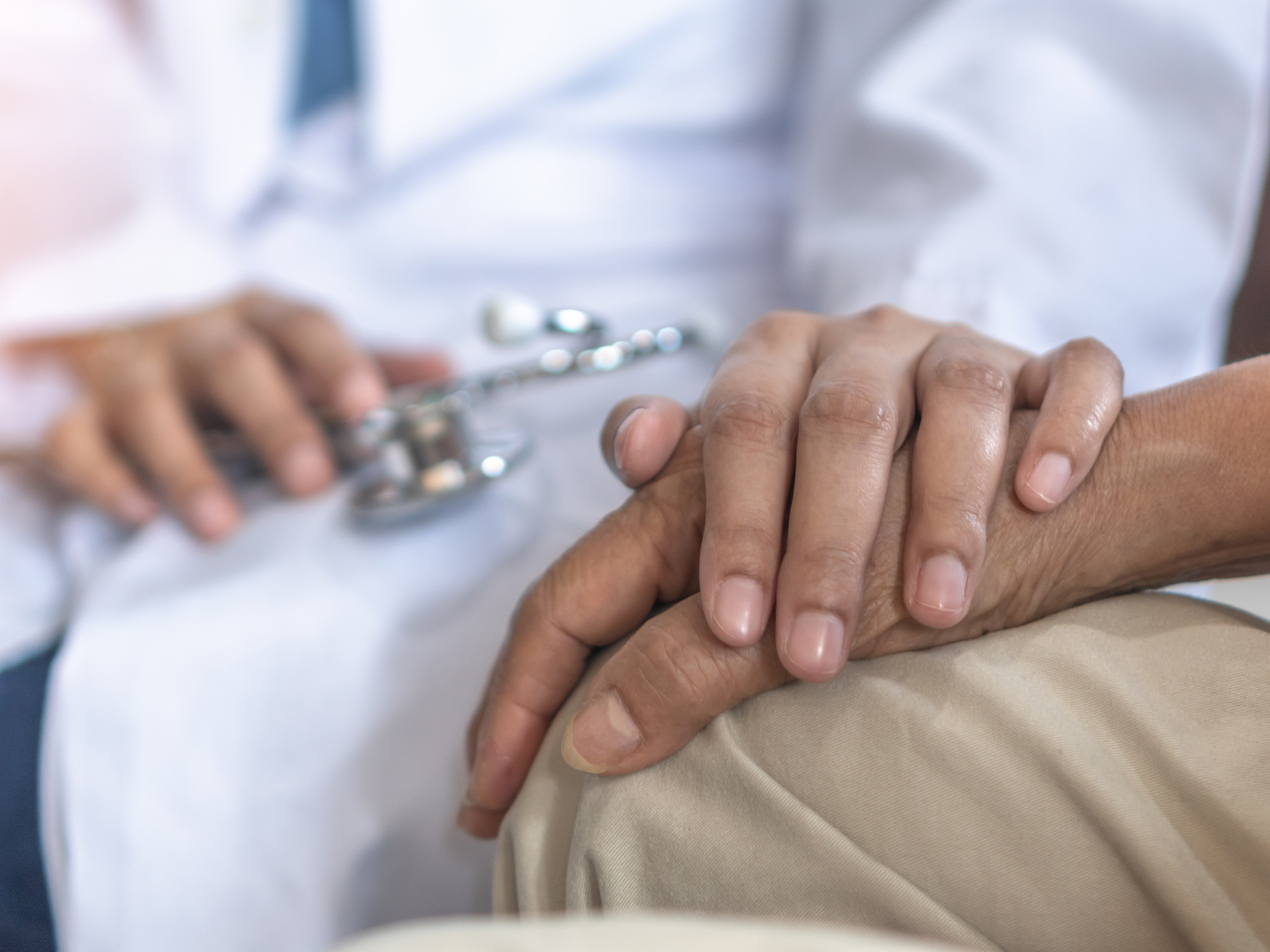 arkinson's disease patient with movement disorder doctor consulting