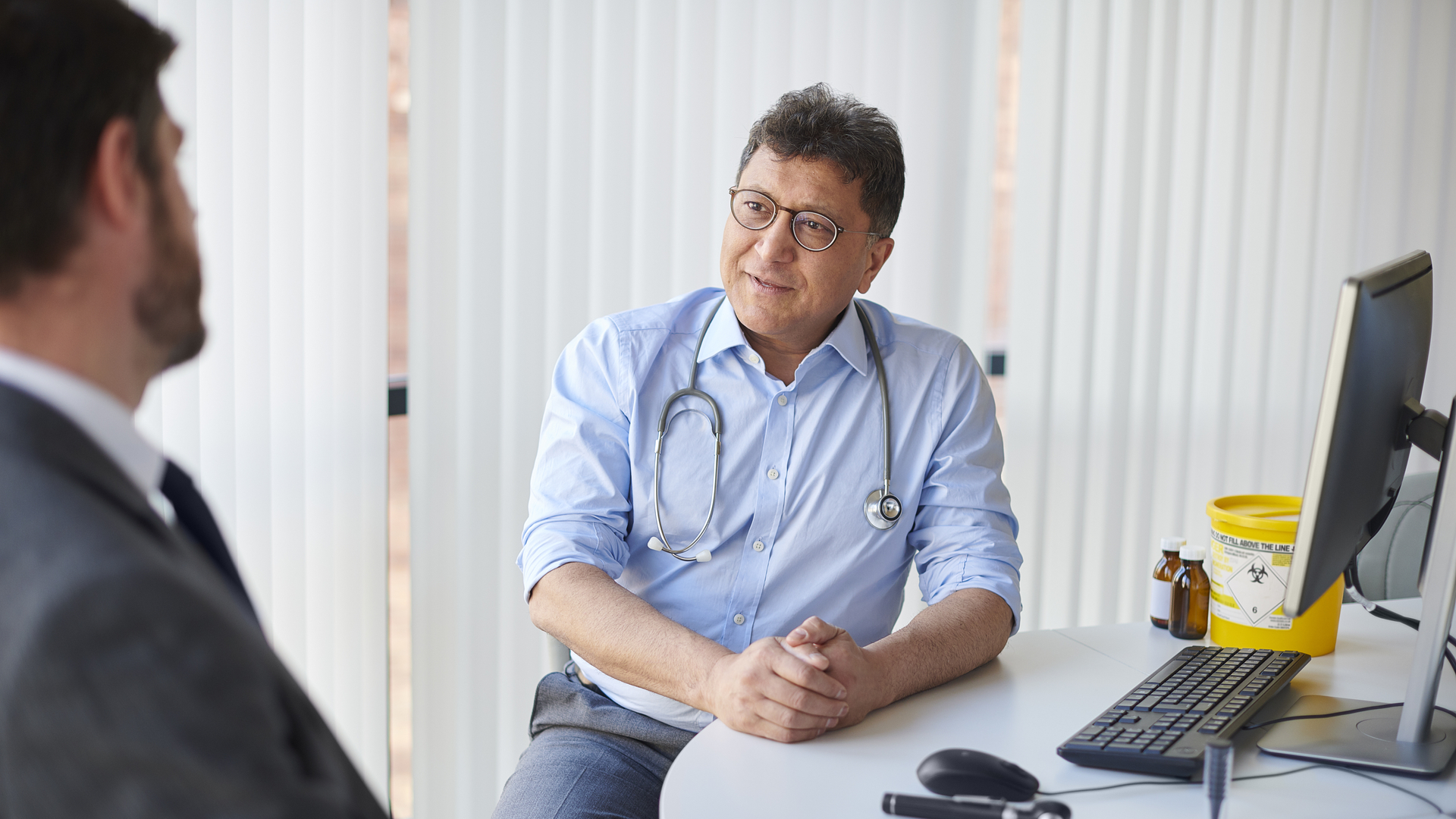 Doctor speaking with a corporate patient