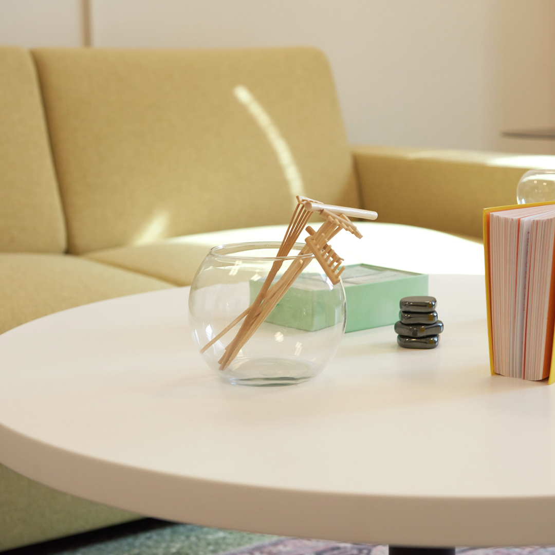 Tiny wooden rakes for a zen garden are among meditative items on a low table