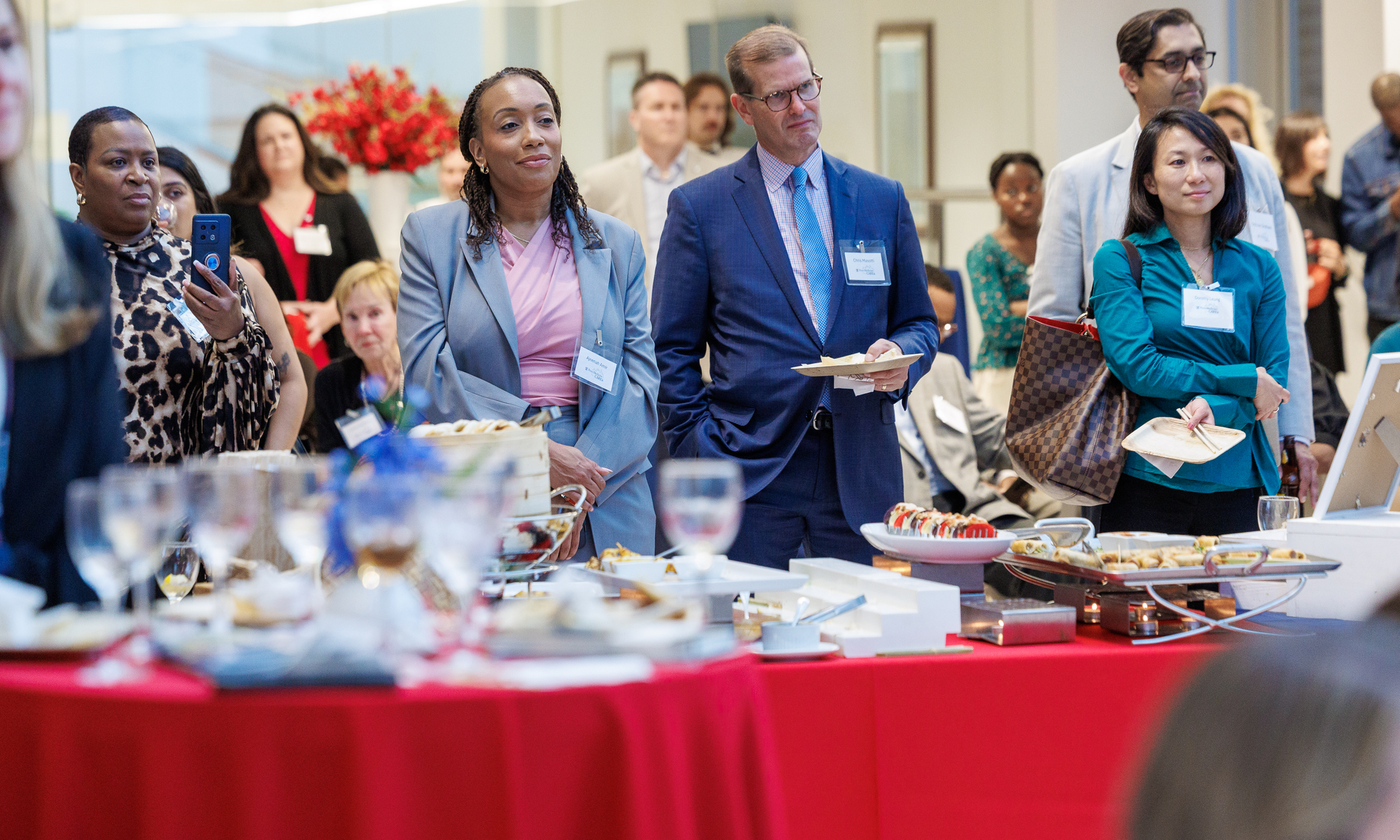 Attendees standing at a reception