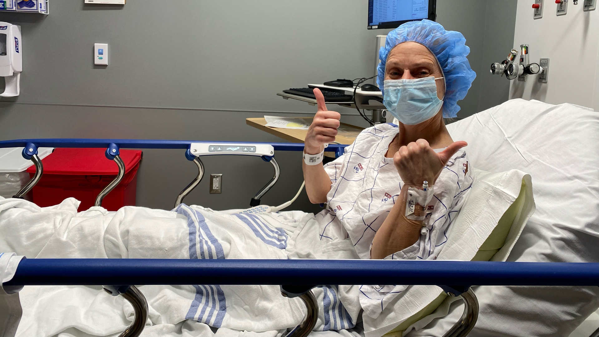 Joanie Shappell gives two thumbs up before she heads into surgery