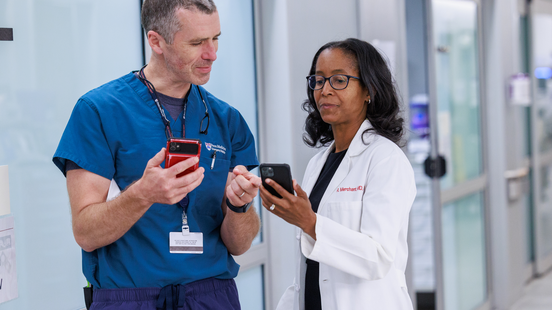 UPHS Vice President Raina Merchant, MD, MSHP shows Emergency Medicine nurse how to use electronic paperwork on mobile device