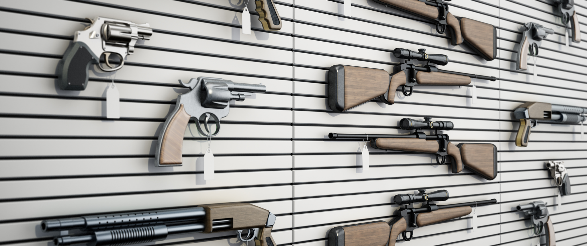 Firearms hang on the wall of a gun store