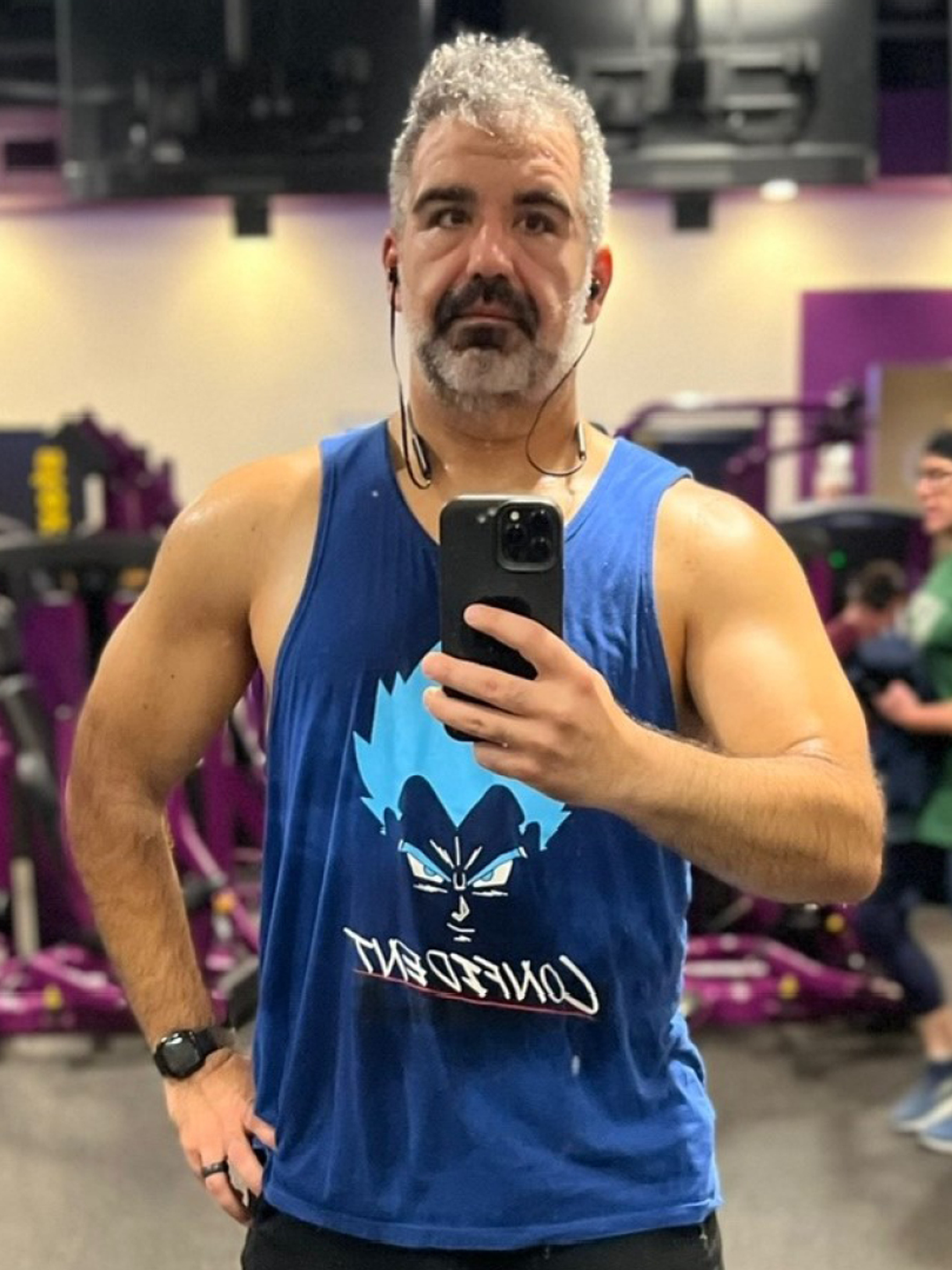 Rob Dimedio takes a photo of himself in the gym mirror