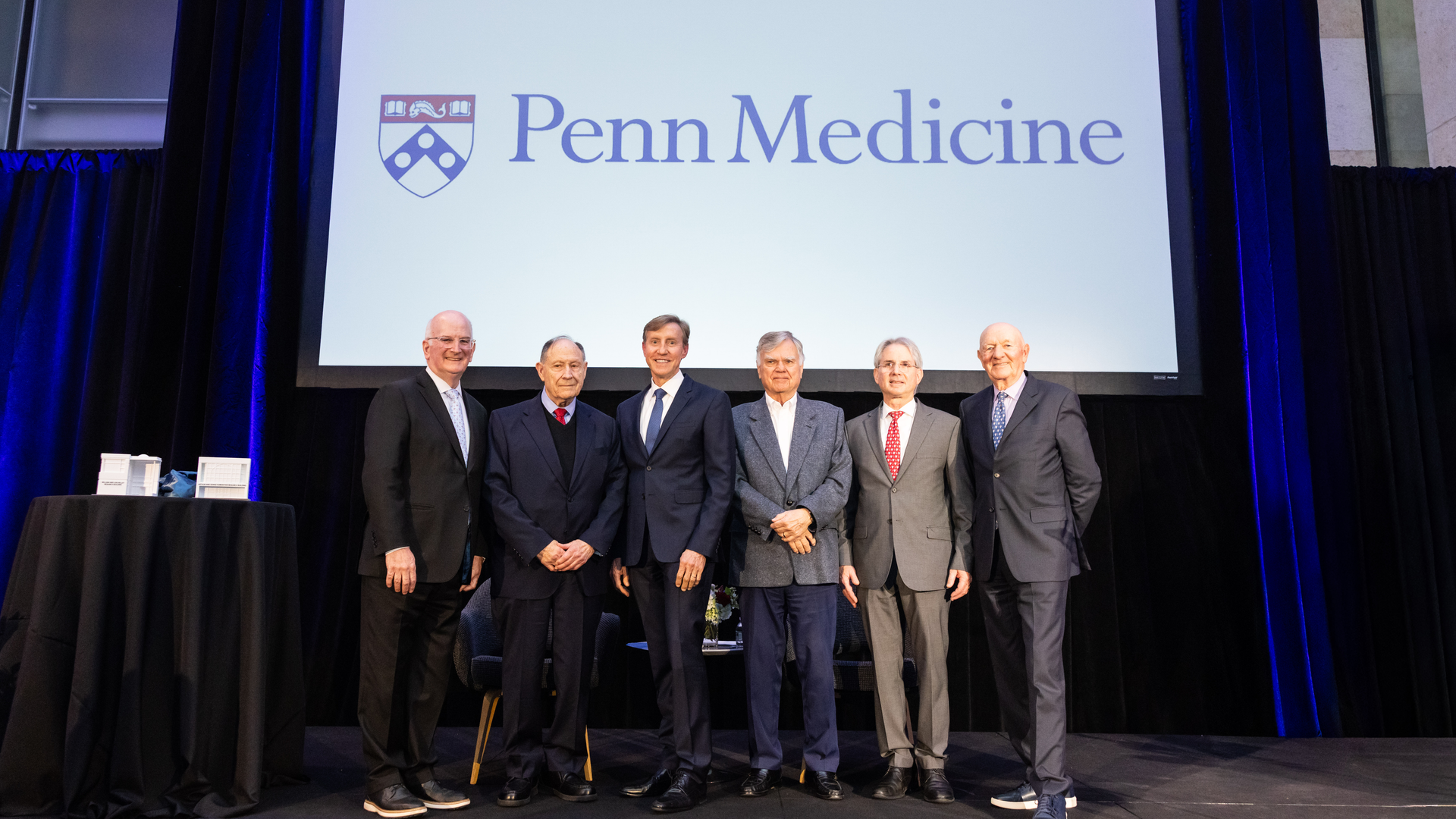 Kevin Mahoney, Arthur Rubenstein, J. Larry Jameson, Jonathan Epstein, and Ralph Muller, standing in front of a Penn Medicine logo on a screen