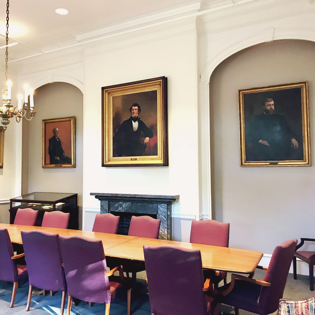 A modern-day conference room with arched shape alcoves in the walls