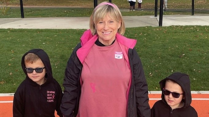 Jane Gesemyer holds hands with her two grandsons