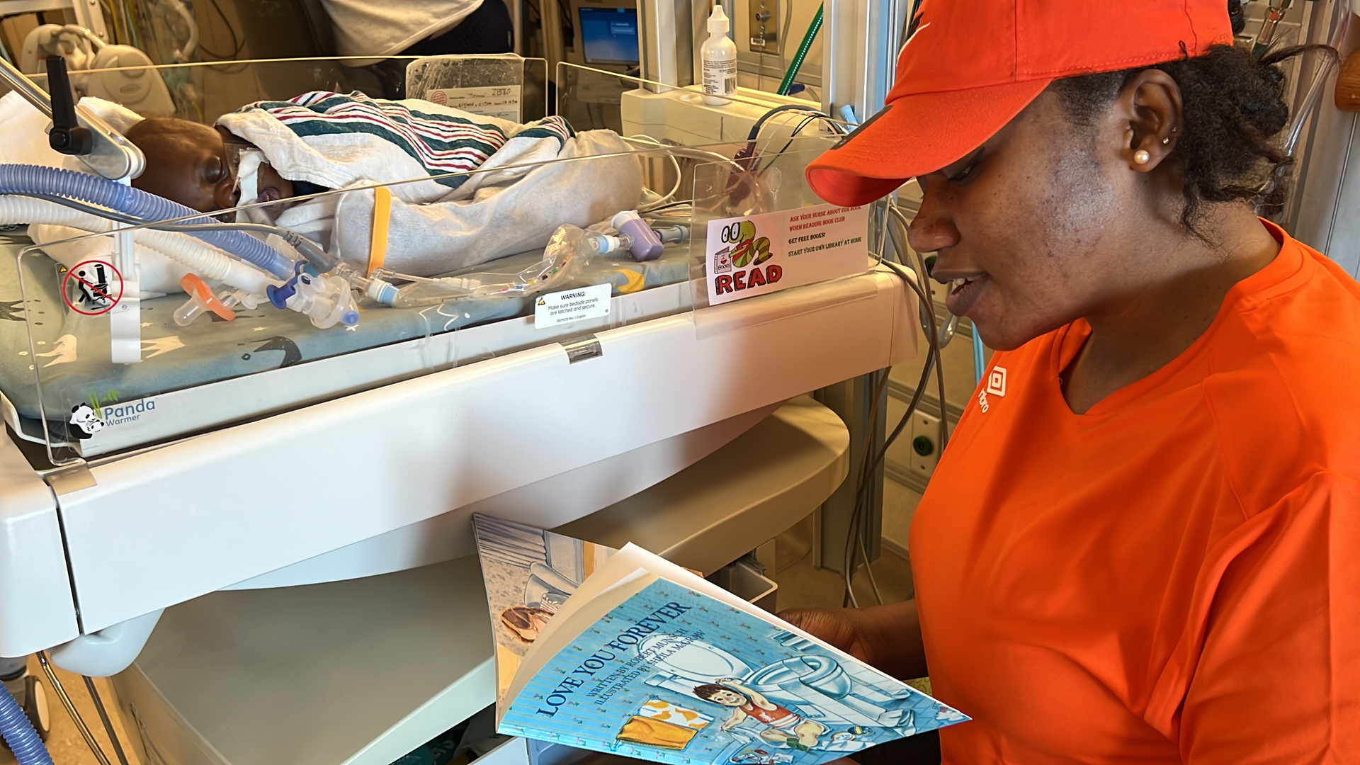 Mother Boura Zerbo reads to her baby, Mohamed, in the intensive care nursery. 