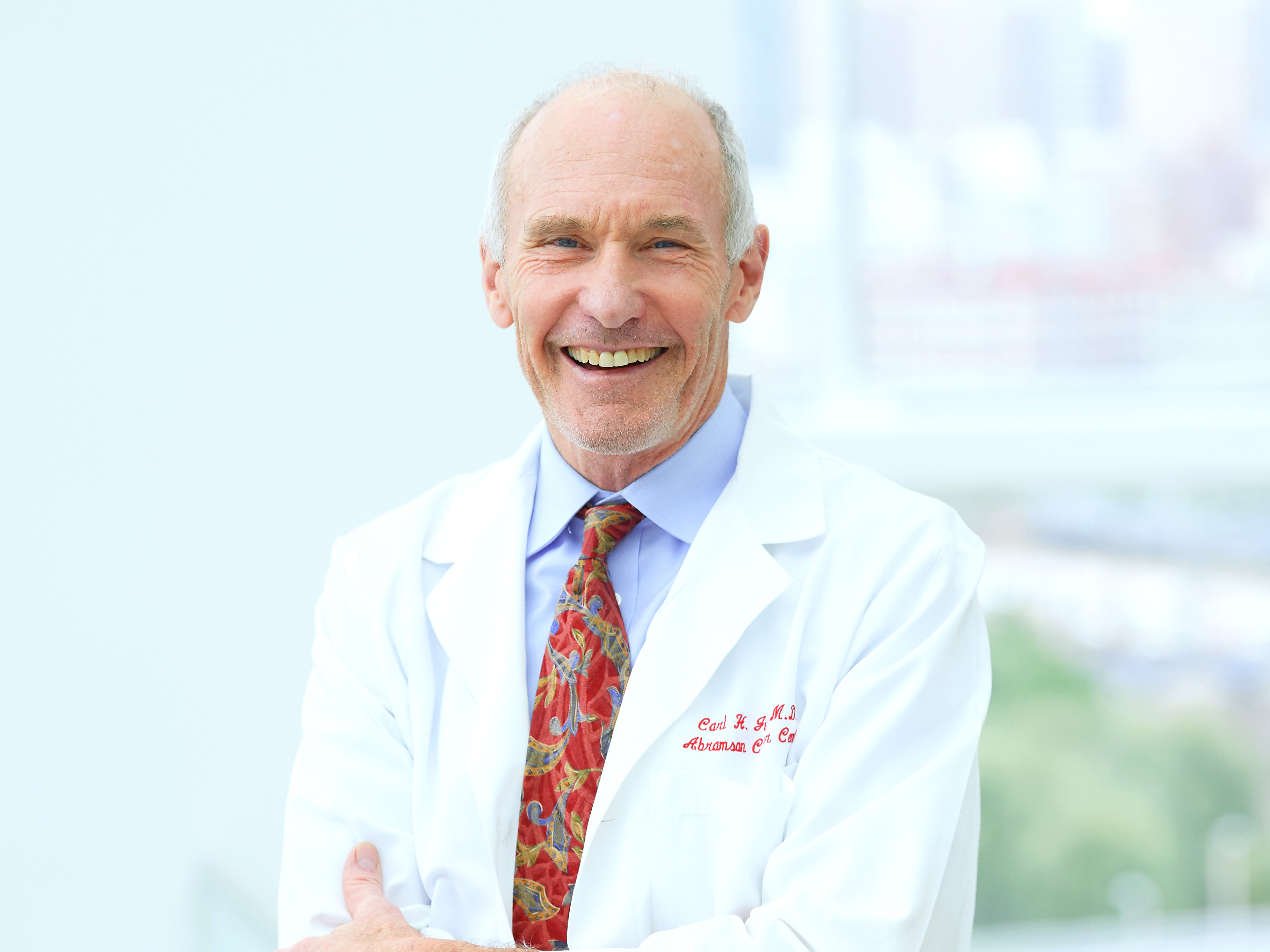 Immunotherapy pioneer, Carl June, smiles inside the Penn Medicine Abramson Cancer Center