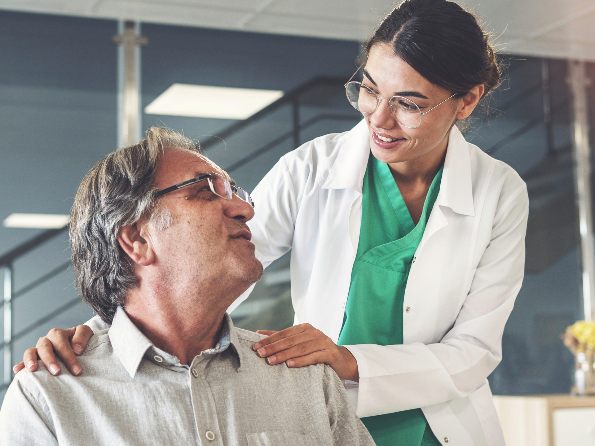 Health worker talking to a stroke patient