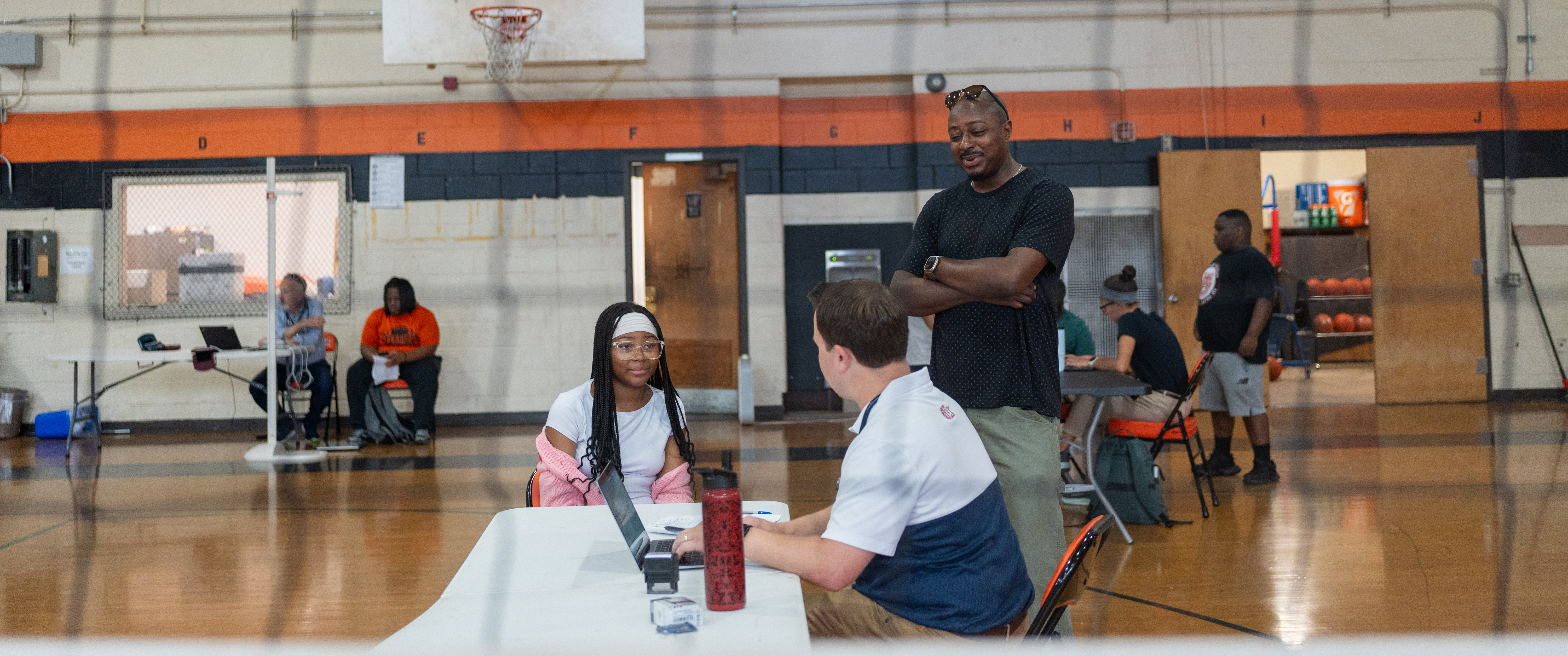 Students and families checking in with Penn Medicine clinicians during a sports physicals event at Overbrook High School