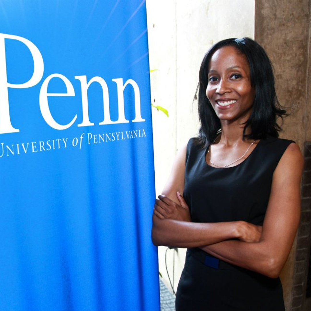 Raina Merchant stands beside a Penn banner in 2012 during a MyHeartMap challenge event