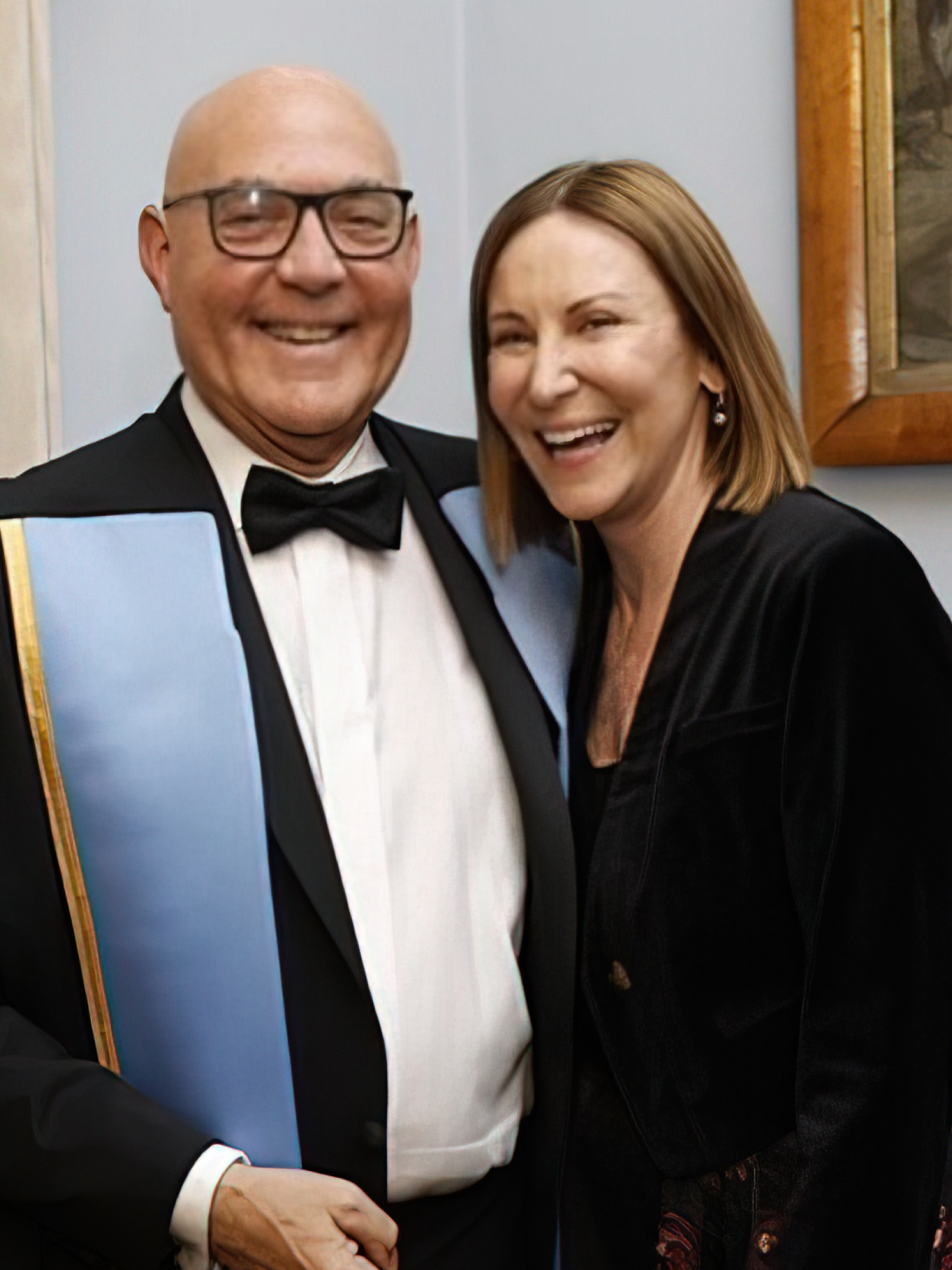Noel Williams and Emma Meagher, both smiling, in formal attire