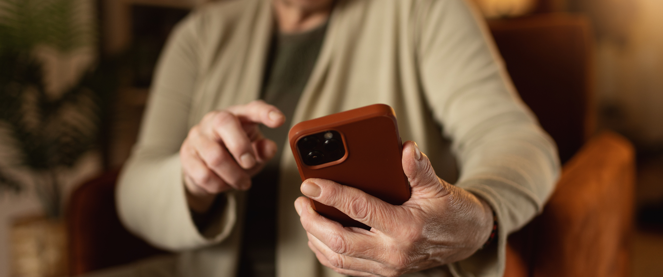 A woman answering a text message on her phone.