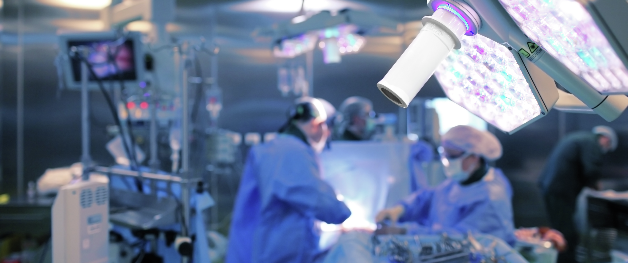 Surgeons performing a procedure in a surgical room
