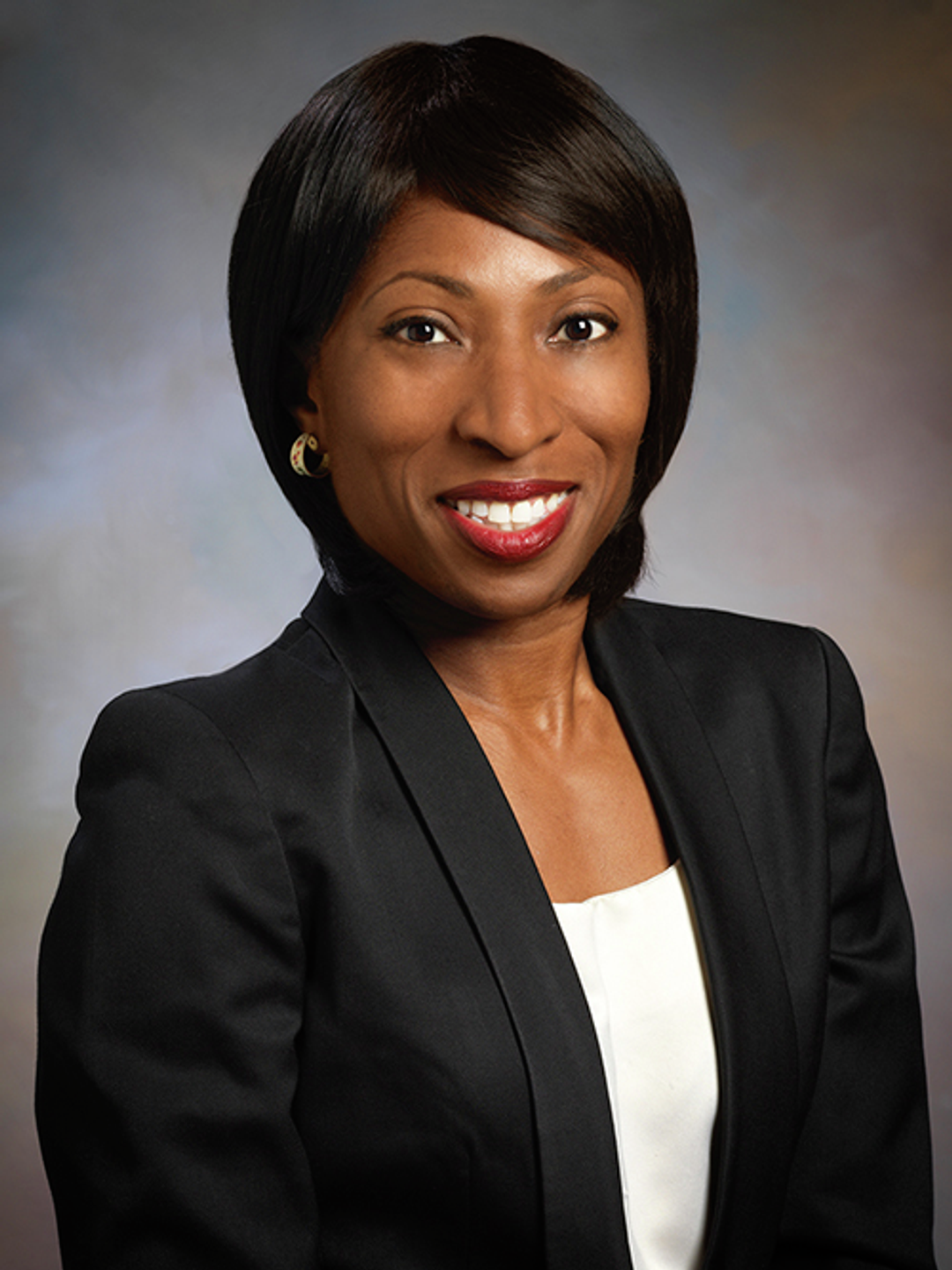 Headshot of Ada Emuwa, MD, in a blazer