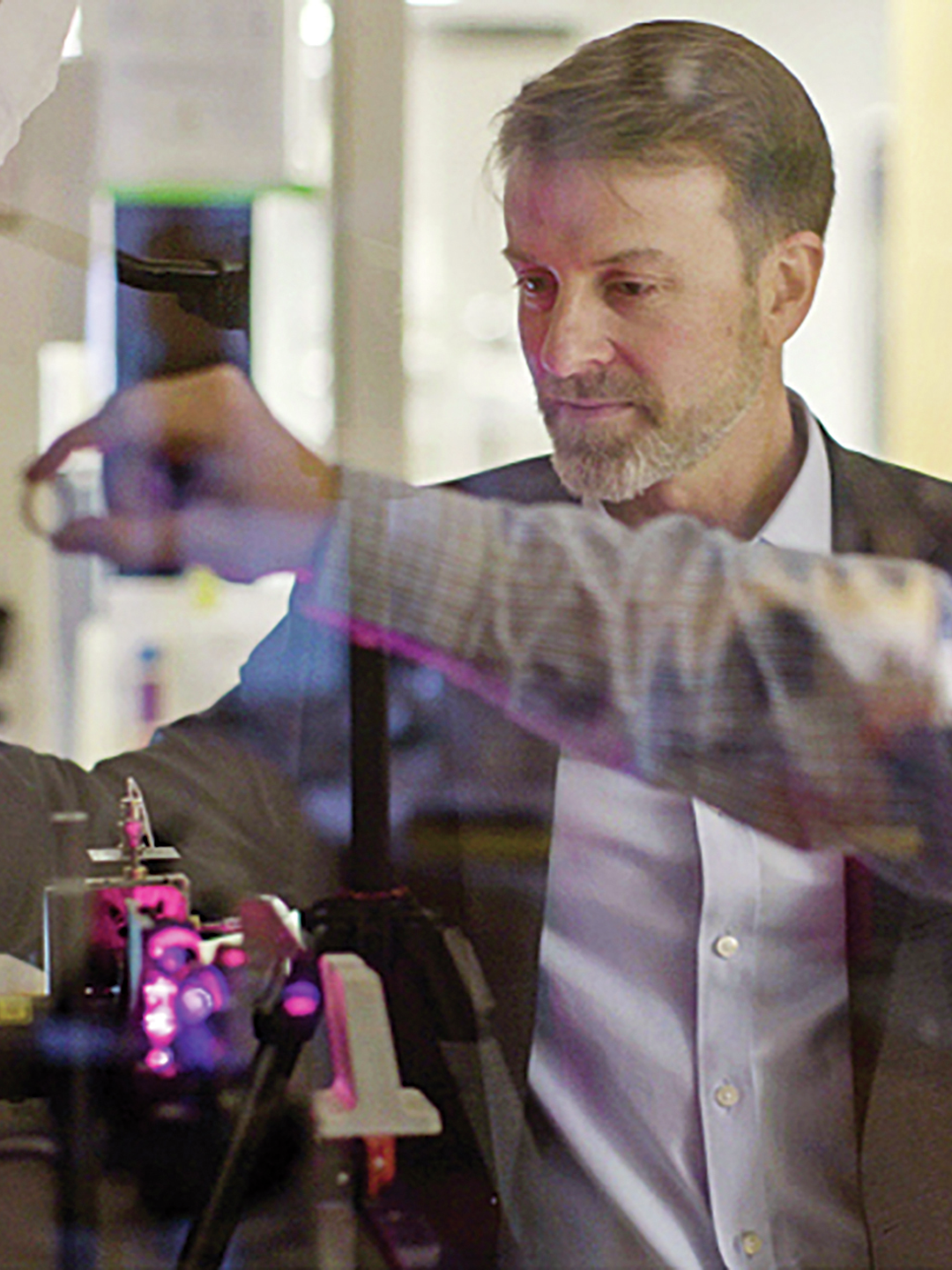 John Wherry, PhD, with another person in a lab