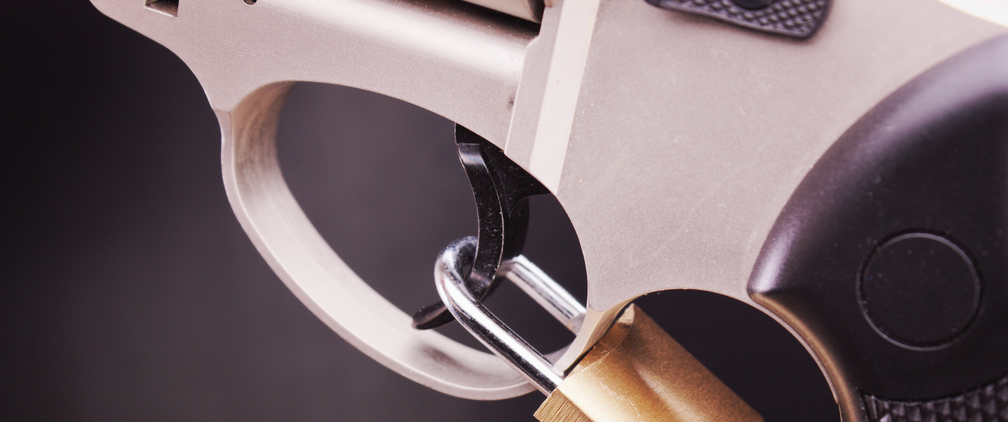 A gun with a lock on the trigger