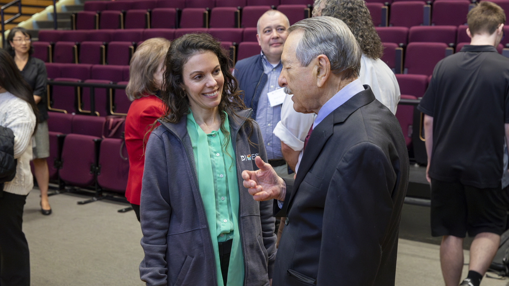 Ralph Brinster, VMD, PhD, talks with Jamie Shuda, EdD, at the Ralph L. Brinster Symposium