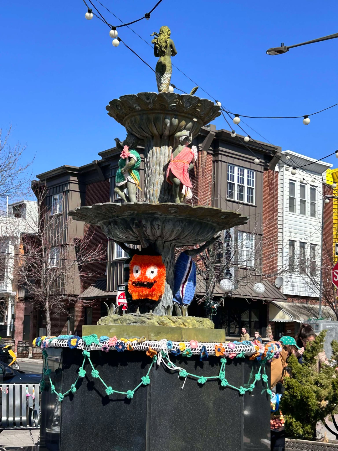 A yarn installation on the East Passayunk Singing Fountain, with a Gritty knit piece created by Linda Ruggiero