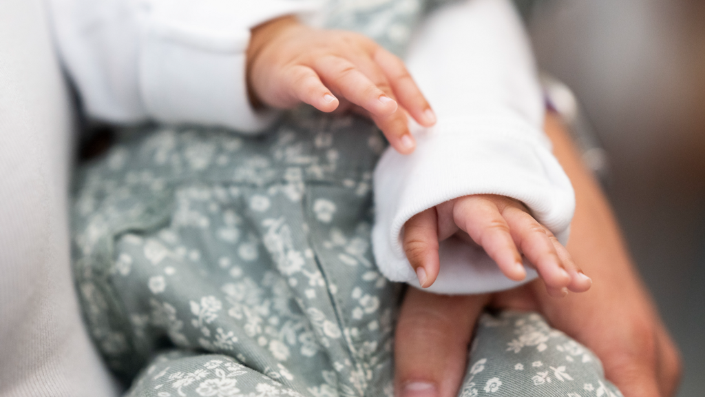 Hands of baby Olivia