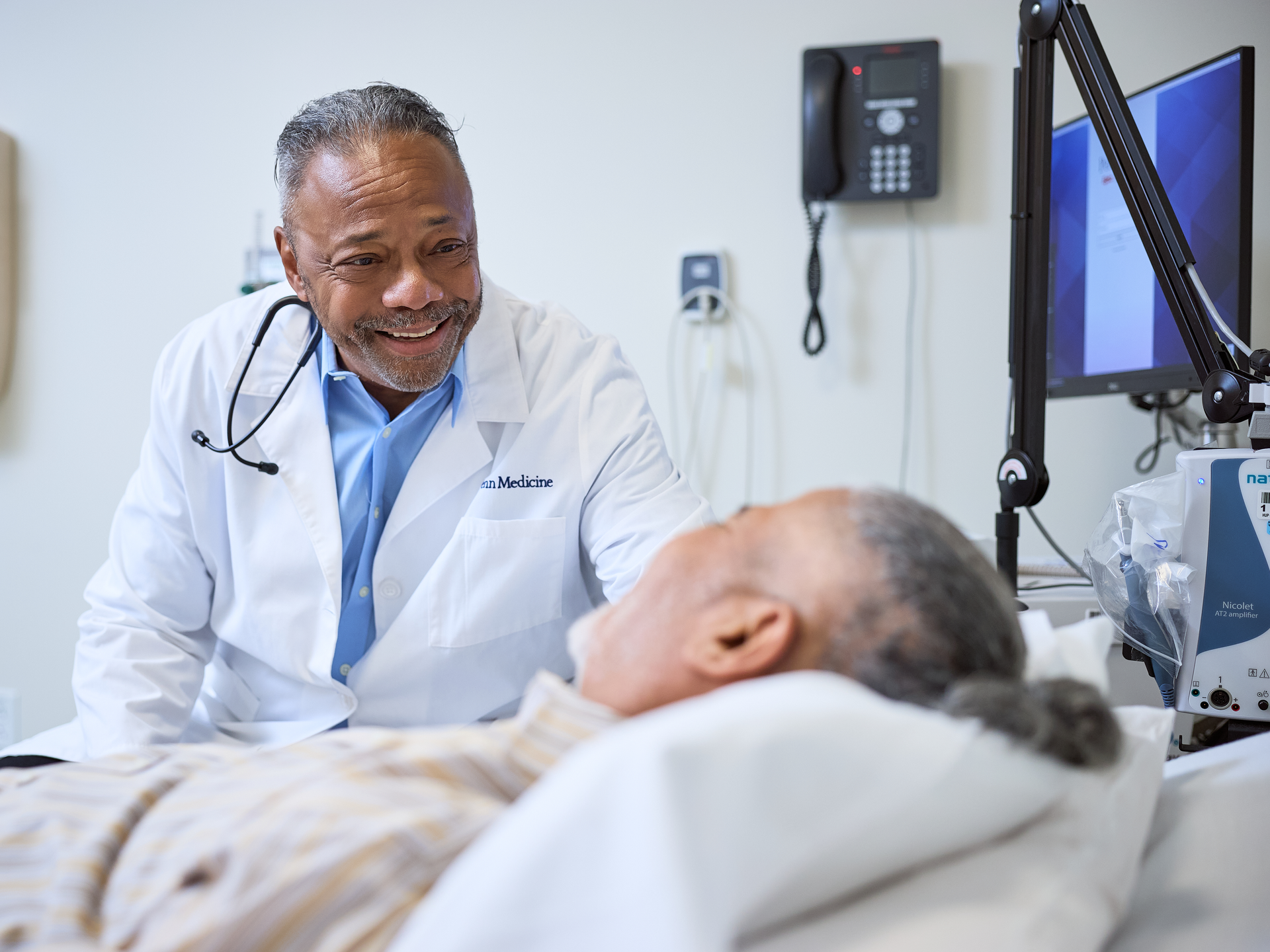 Neurologist visiting a patient at the recovery center