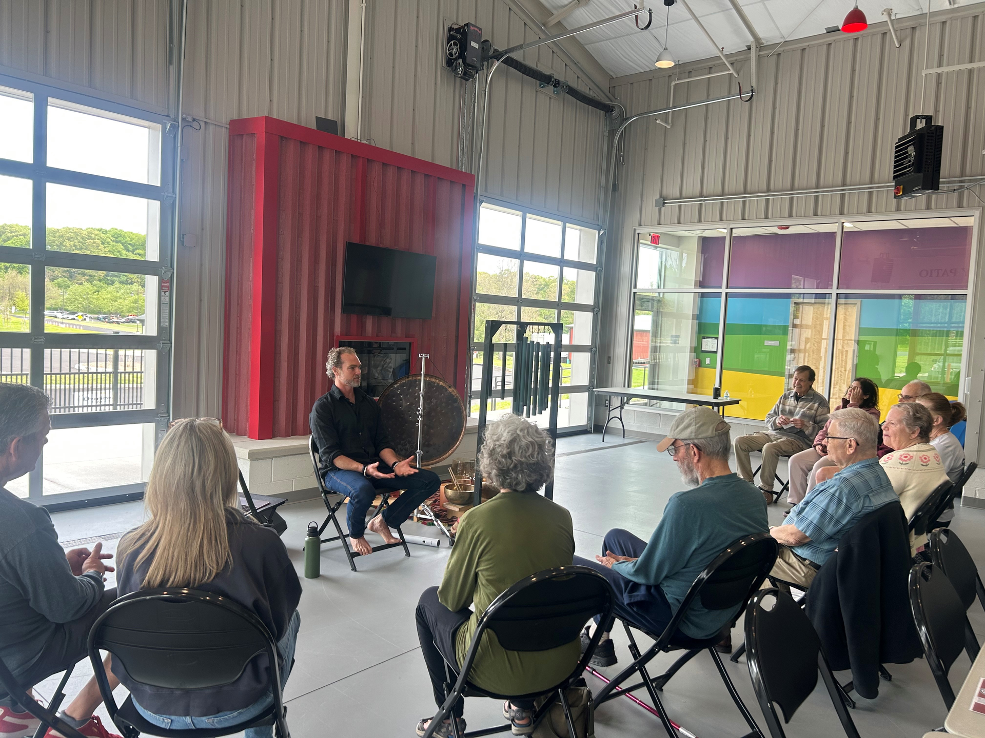 A community event with a speaker and participants.