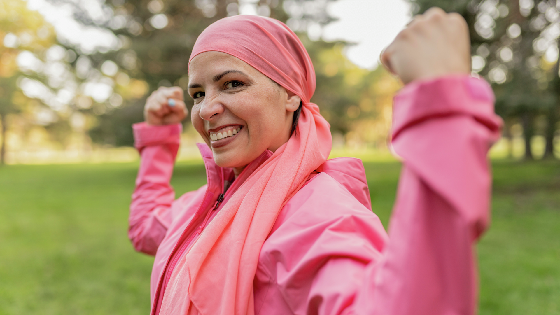 Middle aged woman smiling in a park