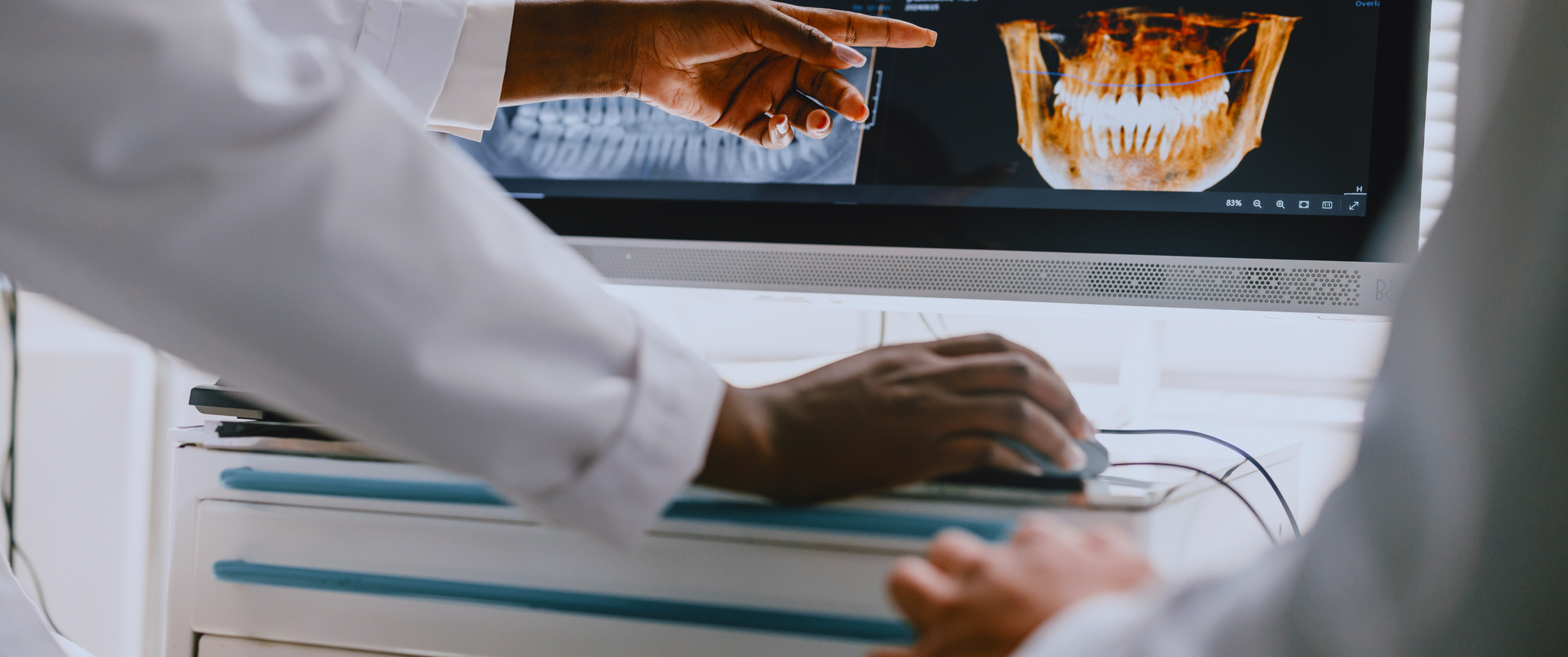 Doctor pointing at an X-ray of the jaw