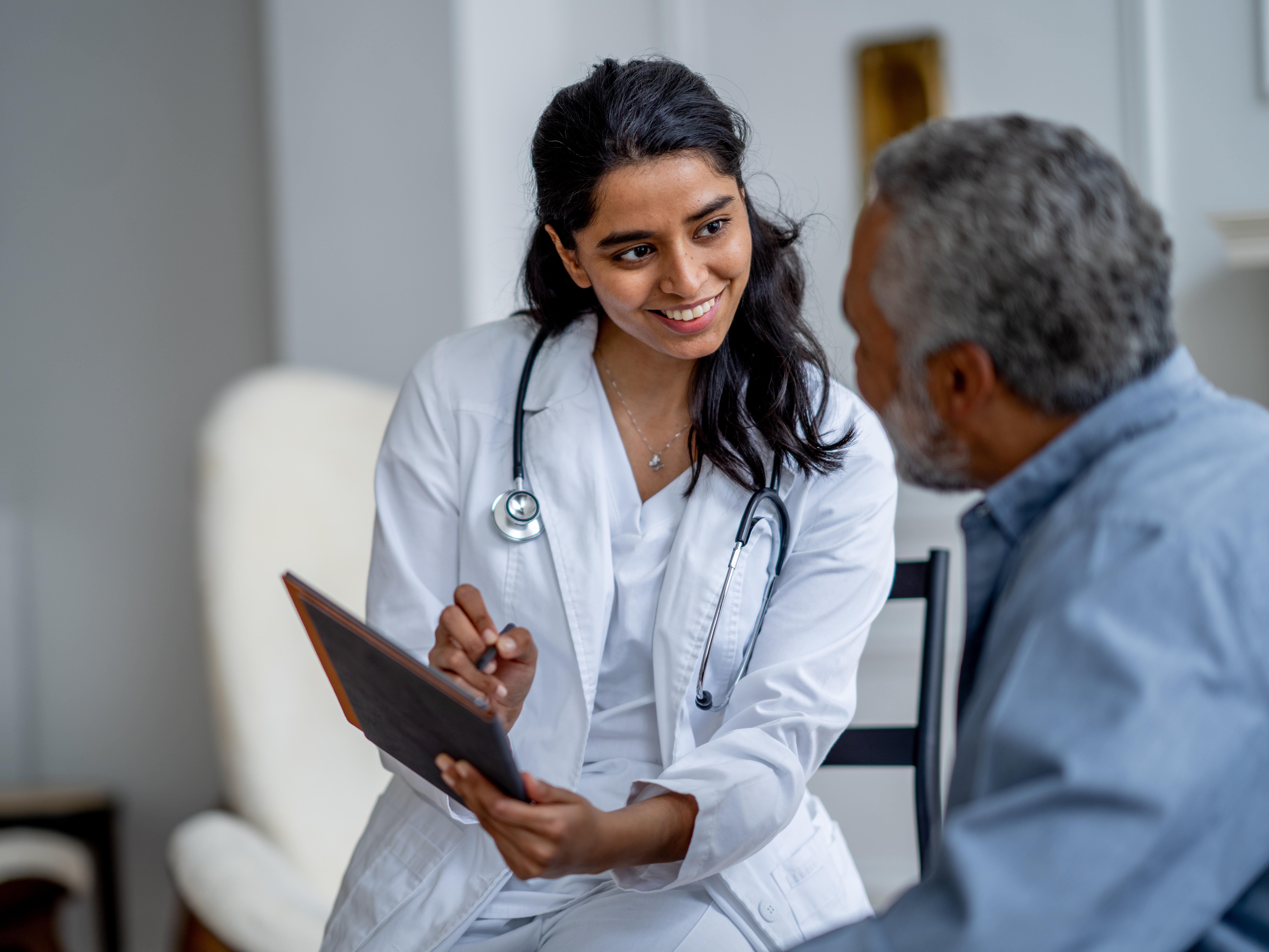 Female doctor meets with her patient during a medical check up. 