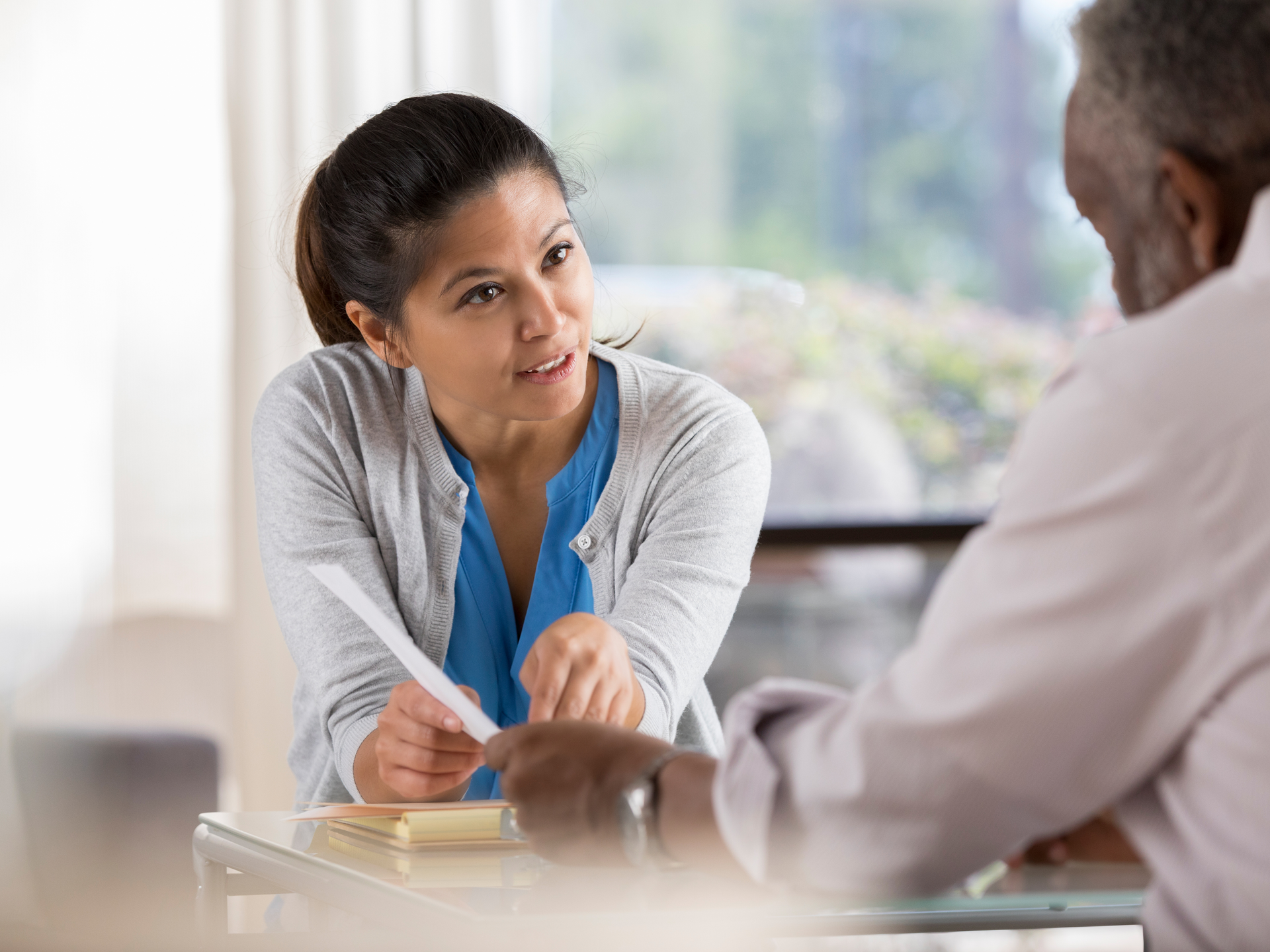 Nurse navigator, Denise Turoczi, speaks with cancer patient at the Ann B. Barshinger Cancer Institute