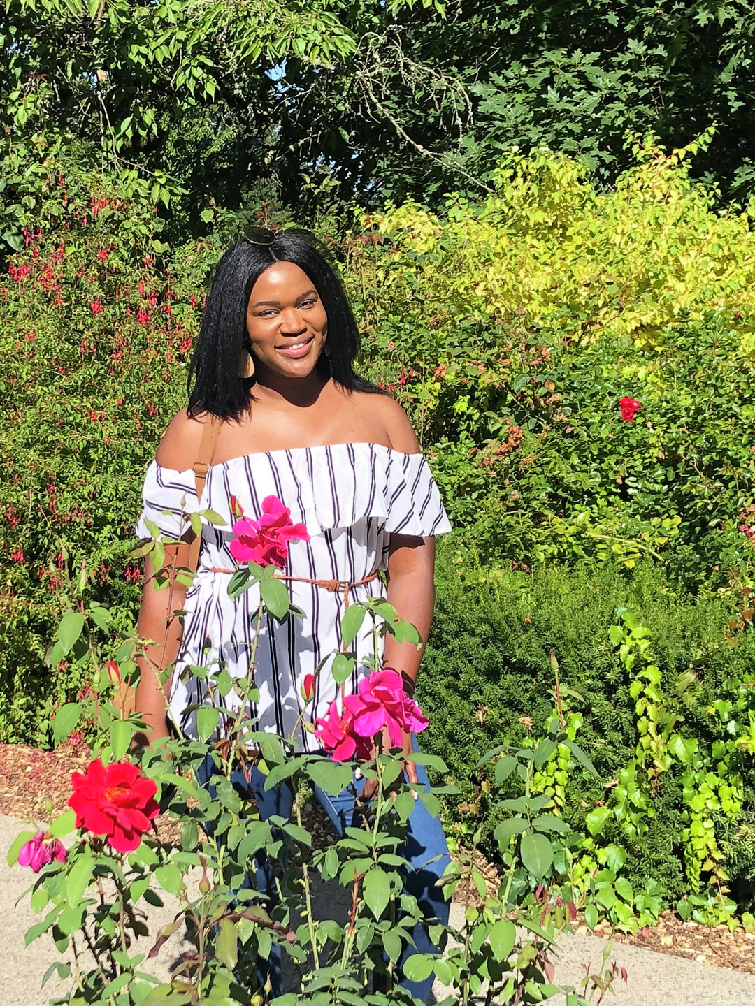 Brooklyn Olumba standing in a garden